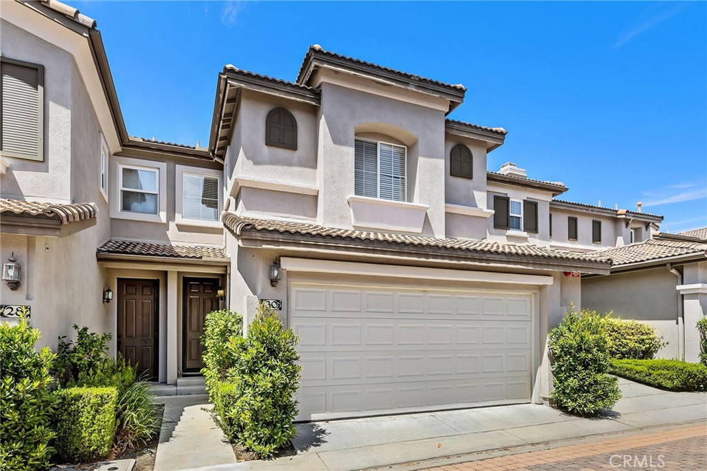 Discover the perfect blend of class, comfort, and convenience at 30 Trofello Ln, located in the desirable Milano community of Aliso Viejo. This beautifully updated end unit home features 2 bedrooms, 2 1/2 bathrooms, and more than 1,100 sq ft of living space.
Step inside to find a freshly painted interior with brand new carpet throughout the upstairs, enhancing the home's inviting atmosphere. The kitchen features newer appliances, making meal prep a delight.
Upstairs, you'll find a built-in work or sitting nook, perfect for remote work or study. The second bedroom is equipped with an en suite bathroom, ensuring privacy and convenience for family and guests alike. The primary suite features a recently remodeled bathroom that boasts a luxurious walk-in shower and a separate soaking tub, perfect for unwinding after a long day. The spacious walk-in closet provides ample room for storage and organization. Laundry is also located in its own closet upstairs for additional convenience.
The outdoor space is a true highlight, featuring a spacious yard complete with a firepit and built-in seating, perfect for entertaining or enjoying quiet evenings under the stars. There is also outdoor gate access to the yard which is a unique feature to this home! Additional features include an attached two-car garage and access to Aliso Viejo Community amenities, which offer fantastic recreational facilities. In your immediate community you have access to a pool and spa and there are two community parks within walking distance.
With nearby hiking and biking trails and picturesque Soka University just minutes away, this home offers a lifestyle of adventure, culture and relaxation. Don’t miss your chance to own this exceptional property, schedule a showing today to experience everything 30 Trofello Ln has to offer!
