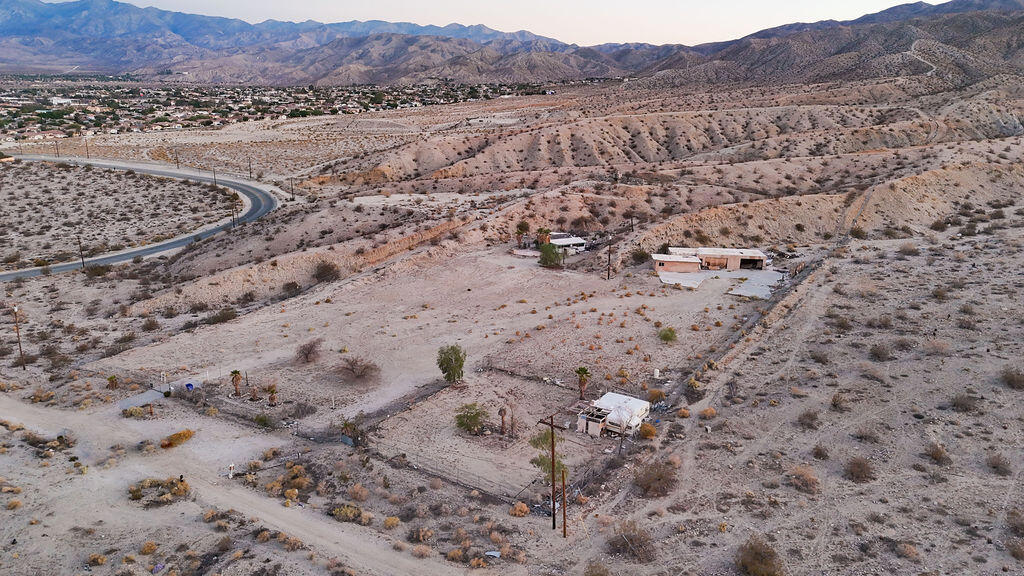 Endless Possibilities in the Spa Zone - 4.5 Acres on Miracle Hill! An extraordinary opportunity awaits in the heart of Desert Hot Springs' world-renowned Spa Zone. This combined 4.5-acre parcel--consisting of a 3.5-acre and a 1-acre lot--is zoned Commercial-Visitor or Multi-Use, offering flexibility for a residential subdivision, boutique hotel, wellness retreat, or spa resort.Once part of the historic Cabot Yerxa Estate, the property is rich with story and soaked in healing hot mineral waters. Located on the elevated north end of Miracle Hill and Pierson, it offers sweeping views, electricity on-site, a private well, and two separate APNs being sold together. There are two small abandoned structures and a trailer to be removed--clearing the way for your vision. Bonus: Seller financing available--a rare chance to secure a property with so much promise and potential. Inspiration plans for a spa retreat available. This is more than land--it's a legacy in the making. Being sold with APN 642-060-008