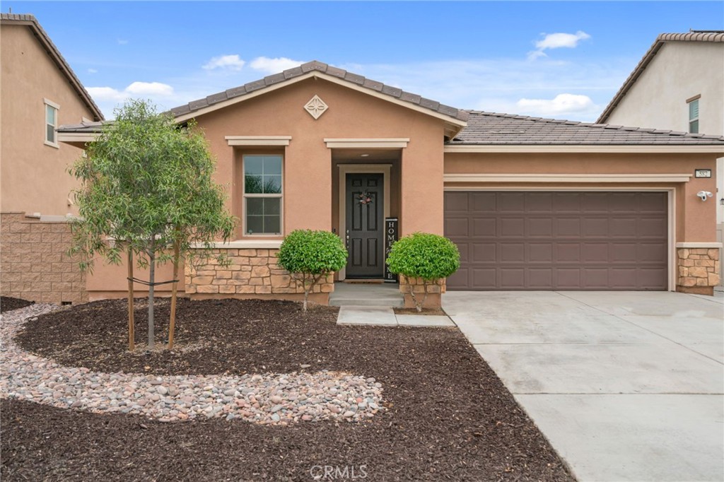 Welcome to this stunning single-story home in the desirable Seasons at Green Valley Ranch community! Built with modern living in mind, this nearly new home offers 3 spacious bedrooms plus a versatile office/flex room that can easily serve as a 4th bedroom. Step inside to discover stylish upgrades throughout, including custom paint, luxury vinyl plank flooring, and recessed lighting. The open-concept floor plan seamlessly connects the great room, dining area, and gourmet kitchen, perfect for entertaining and everyday living. The kitchen is a showstopper, featuring custom cabinetry, a large center island, granite countertops, stainless steel appliances, and elegant pendant lighting. The private primary suite includes a generous walk-in closet and an ensuite bath with dual sinks and a walk-in shower. Two additional bedrooms are generously sized and share a well-appointed full bathroom with upgraded cabinetry and lighting. Enjoy indoor-outdoor living with double sliding doors that lead to a beautifully designed backyard. Highlights include a built-in covered patio, low-maintenance artificial turf, a custom gazebo with lighting, a built-in fire pit, and attractive hardscaping, ideal for hosting guests or relaxing with family. Block walls and vinyl fencing provide privacy and a finished look. Don’t miss your chance to own this beautiful home in a growing and vibrant area of Perris. Schedule your private tour today!