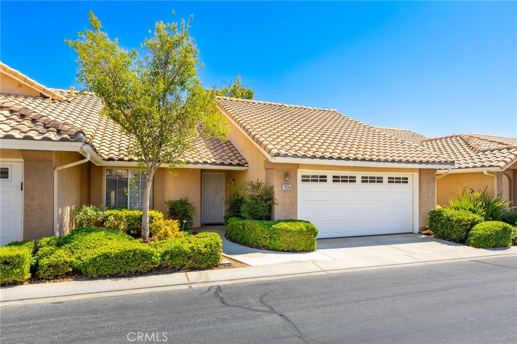 Looking for a condo with a superb floorplan and a comforting backyard, then 668 La Costa Drive in fabulous Sun Lakes Country Club is your next address. This wonderful Santa Rosa condo features 921 square feet with 2 bedrooms, 2 bath, living, dining room and a cozy kitchen. The primary suite offers a privacy bath and large window overlooking the spacious patio area. A guest bedroom comes with a Murphy Bed allowing room for everyday use and a bed for special guest. The guest bathroom had been upgraded and conveniently located right next to the guest bedroom. There is plenty of room to gather in the living room and the dining area just off the kitchen is perfect for any mealtime. The kitchen features a newer dishwasher, microwave oven and more. The very spacious backyard lined with vinyl fencing, handsome pavers and an aluma-wood patio cover is ready for any summer evening gathering. Just outside the backyard gate is a pristine green-belt, ready for any leisurely walk. This condo offers lock-and-leave living with a 2 car attached garage with work bench and attic storage. This splendid condo is located within a golf-course community with views, clubhouse access, pools and many social events. A perfect lifestyle for any 55+ active adult.