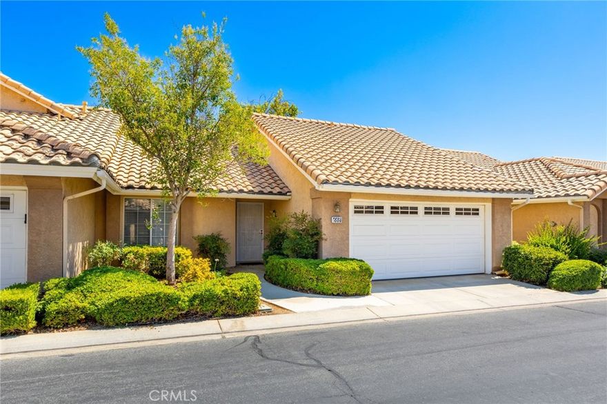 Looking for a condo with a superb floorplan and a comforting backyard, then 668 La Costa Drive in fabulous Sun Lakes Country Club is your next address.  This wonderful Santa Rosa condo features 921 square feet with 2 bedrooms, 2 bath, living, dining room and a cozy kitchen.  The primary suite offers a privacy bath and large window overlooking the spacious patio area.  A guest bedroom comes with a Murphy Bed allowing room for everyday use and a bed for special guest.  The guest bathroom had been upgraded and conveniently located right next to the guest bedroom.  There is plenty of room to gather in the living room and the dining area just off the kitchen is perfect for any mealtime.  The kitchen features a newer dishwasher, microwave oven and more. The very spacious backyard lined with vinyl fencing, handsome pavers and an aluma-wood patio cover is ready for any summer evening gathering.  Just outside the backyard gate is a pristine green-belt, ready for any leisurely walk.  This condo offers lock-and-leave living with a 2 car attached garage with work bench and attic storage.  This splendid condo is located within a golf-course community with views, clubhouse access, pools and many social events.  A perfect lifestyle for any 55+ active adult.