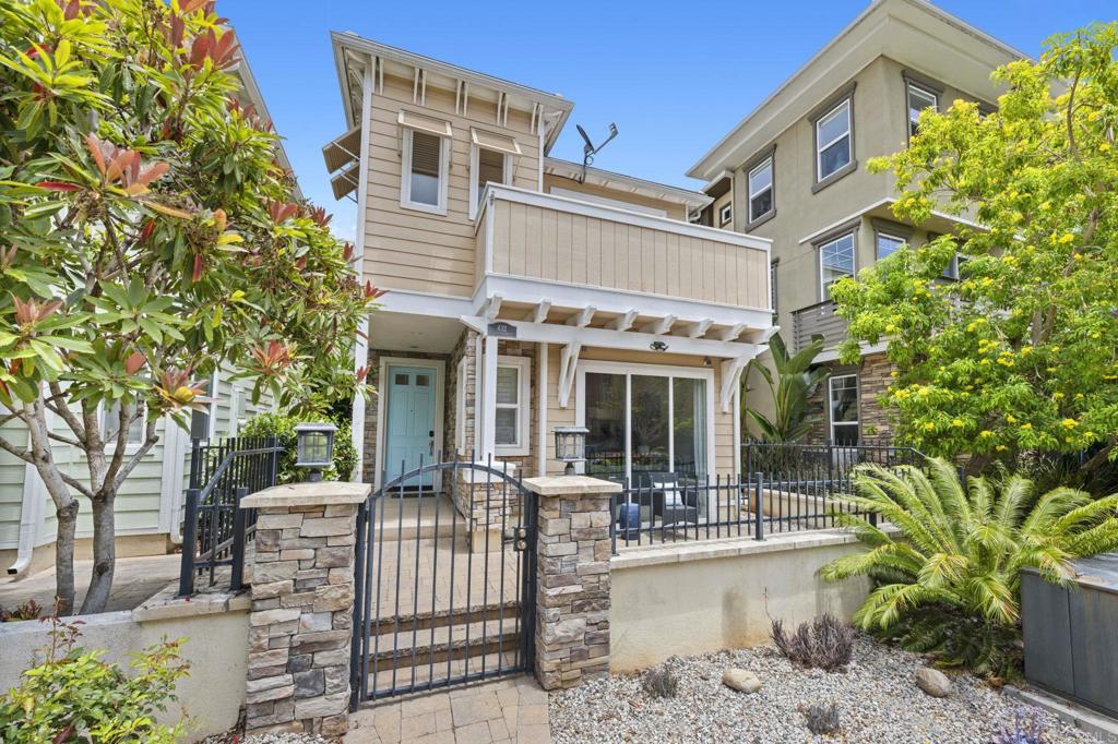 Exceptionally well-maintained home in ideal location near the beach, pier and downtown Oceanside. The great room offers abundant light with large floor to ceiling windows. Kitchen has a large center island, stainless steel appliances and Silestone counters. A double-sided fireplace separates the dining and formal Livingroom. Travertine floors are throughout main living areas, carpet only on stairs and secondary bedrooms. The rooftop deck offers peak-a-boo ocean views. Energy efficient property with dual pane windows and owned solar. Master suite offers private balcony, large walk-in closet, and oversized bath with dual-sinks and jetted spa tub. All bedrooms have ensuite baths with a ½ bath on the first floor. Two car garage with ally access has epoxy floors and overhead storage. Home has been used as a short-term rental and can be sold furnished if buyer would like. Only a few blocks to restaurants, shopping, The Pier, and everything that Oceanside has to offer.