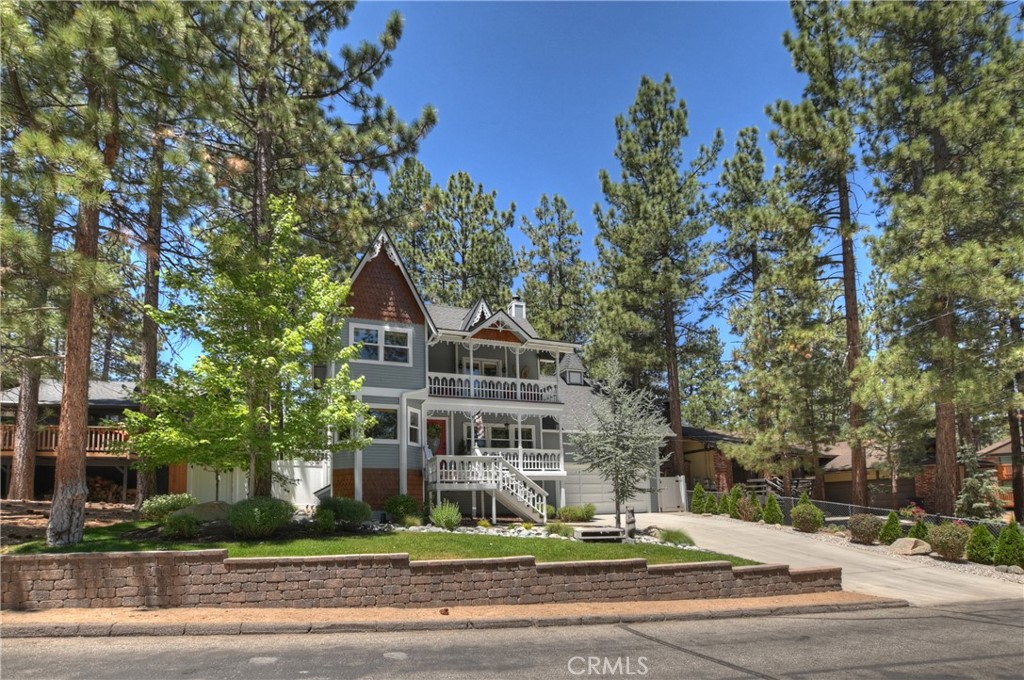 VICTORIAN style BIG BEAR HOME IN THE MOUNTAINS. 3 BD 2 BA HOME WITH AN ADDITIONAL ROOM FOR AN OFFICE OR 4TH BEDROOM. PRIVATE DECK OFF THE MASTER. WOOD FLOORS, FENCED AND LEVEL LOT WITH Balconies off of each bedroom, SPA. 2 CAR GARAGE WITH ADDITIONAL (room) SPACE ABOVE. Driveway will fit 6 cars, plus addtional parking in the back. LOW MAINTENANCE LANDSCAPING! GREAT NEIGHBORHOOD CLOSE TO SLOPES & TOWN. Darling vintage look kitchen with real wood flooring! Claw foot soaking tub in bathroom. This beauty has AC! This home has plenty of space for entertaining family and friends. Garage fits 2 cars, currently is being used as game room w/ upper loft with workout space, shelving, cabinets, racks for snowboards and skis, bike racks, kayak storage racks. Lower garage- epoxy floor, dry bar built in w/cabinets and built in fridge. New vinyl fencing. Roof is 3 years new, exterior recently painted, upgraded electrical panel, new dual pane windows throughout w/gorgeous bamboo blinds throughout. Meticulously maintained. Buyer will not need to do anything, just move in, kick up your feet and enjoy the quiet & peaceful neighborhood. Front & backyard professional landscaped w/irrigation.
