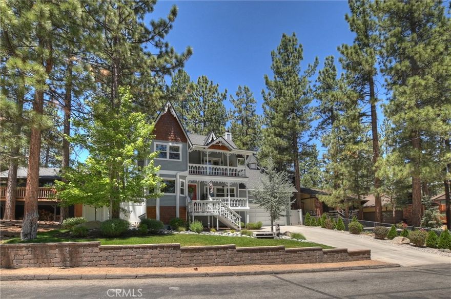 VICTORIAN style BIG BEAR HOME IN THE MOUNTAINS. 3 BD 2 BA HOME WITH AN ADDITIONAL ROOM FOR AN OFFICE OR 4TH BEDROOM. PRIVATE DECK OFF THE MASTER. WOOD FLOORS, FENCED AND LEVEL LOT WITH Balconies off of each bedroom, SPA. 2 CAR GARAGE WITH ADDITIONAL (room) SPACE ABOVE. Driveway will fit 6 cars, plus addtional parking in the back. LOW MAINTENANCE LANDSCAPING! GREAT NEIGHBORHOOD CLOSE TO SLOPES & TOWN. Darling vintage look kitchen with real wood flooring! Claw foot soaking tub in bathroom. This beauty has AC! This home has plenty of space for entertaining family and friends. Garage fits 2 cars, currently is being used as game room w/ upper loft with workout space, shelving, cabinets, racks for snowboards and skis, bike racks, kayak storage racks. Lower garage- epoxy floor, dry bar built in w/cabinets and built in fridge. New vinyl fencing. Roof is 3 years new, exterior recently painted, upgraded electrical panel, new dual pane windows throughout w/gorgeous bamboo blinds throughout. Meticulously maintained. Buyer will not need to do anything, just move in, kick up your feet and enjoy the quiet & peaceful neighborhood. Front & backyard professional landscaped w/irrigation.