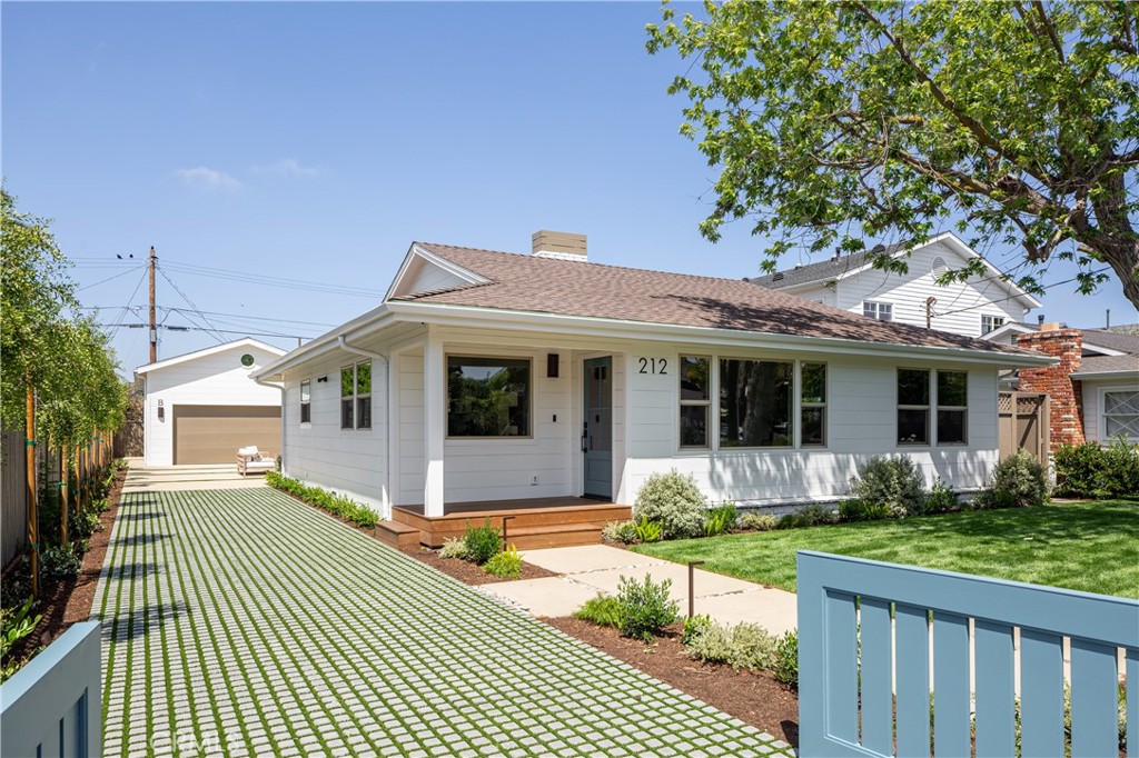 Expertly crafted by local firm Abode Design + Build, known for their thoughtful integration of architecture and interiors, this rare dual-residence property blends timeless coastal style with modern functionality in one of Eastside Costa Mesa’s most coveted neighborhoods. Set on a generously sized 8,000+ sq ft lot, the home offers two completely independent living spaces—ideal for multi-generational living, guest accommodations, or premium rental income. Set behind a gated entry with lush, magazine-worthy landscaping by Orchard Landscaping, the grounds feature extensive new hardscape, a turf block driveway for enhanced curb appeal and drainage, and multiple outdoor areas for entertaining and relaxation. The front residence, a reimagined single-level 3-bedroom, 2-bath home, spans 1,640 sq ft and has been fully remodeled and expanded to create open-concept living with high ceilings and abundant natural light. Large skylights brighten the interior throughout the day, while oversized sliding glass doors create a seamless indoor-outdoor connection. The spacious primary suite includes dual closets and a beautifully appointed bath, offering a true retreat within the home. Built-in speakers provide effortless audio throughout, complementing the all-new appliances, custom cabinetry, and curated finishes. At the rear, a brand-new 2-bedroom, 2-bath ADU (938 sq ft) offers private luxury living with its own entrance, full kitchen, solar panels, and a finished 2-car garage. Like the front unit, it features expansive sliding doors that open to an inviting patio and skylights that fill the interior with light. Built-in speakers and premium materials complete the experience in this high-end, standalone residence. This unique offering delivers flexibility, long-term value, and low-maintenance luxury just minutes from beaches, top schools, restaurants, and retail.