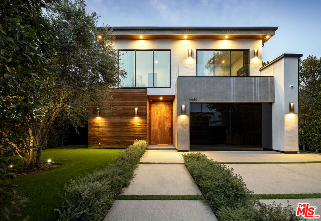 Experience refined living in this beautifully appointed, fully furnished modern home on a gated corner lot, offering complete privacy and peace of mind with advanced security features and Control4 smart home systems.Designed by Interior Particulier, this home showcases sophisticated furnishings and designer finishes throughout. The chef's kitchen is fully equipped and sure to impress even the most discerning cook.Featuring 4 bedrooms with ensuite bathrooms (one currently staged as an office) and 5 bathrooms in total, the layout is perfect for comfort and flexibility. The primary suite is a true sanctuary with a large walk-in closet, cozy fireplace, private terrace, and a spa-inspired bathroom with soaking tub, double vanity, luxury shower, and its own balcony.Ideal for those who love to entertain, this home embraces indoor-outdoor living with a heated swimming pool and spa, a dedicated pool house with half-bath, a built-in grill station, and inviting outdoor seating areas perfect for relaxing or hosting friends and family.Truly a turnkey luxury retreat, this home combines style, comfort, and thoughtful amenities to create an exceptional living experience.