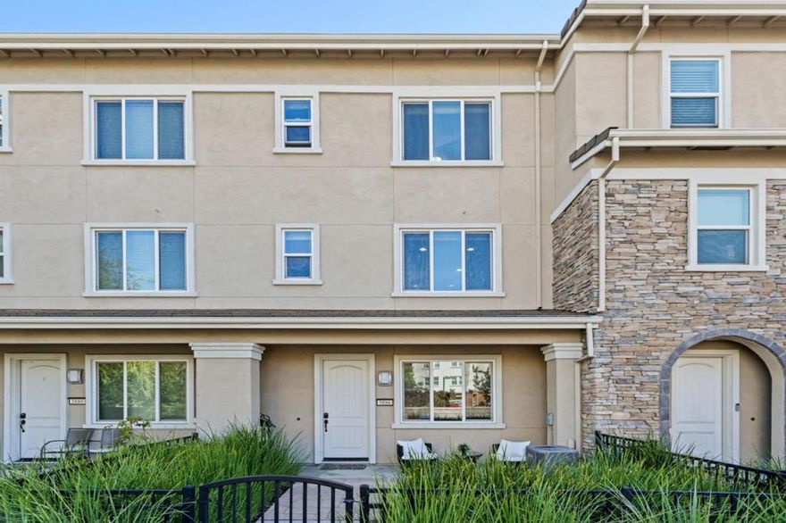 Welcome to this stunning tri-level luxury townhome located in the sought-after Avenue One community. Unit features a private front yard. Bright and open layout and new flooring throughout. The ground-level bedroom with an en-suite bath provides flexibility for guests. The chefs kitchen showcases stainless steel appliances, large center island with breakfast bar, and a walk-in pantry. The adjoining dining and living areas flow seamlessly to a spacious private balconyperfect for morning coffee or evening relaxation.  Upstairs, retreat to the luxurious primary suite featuring a walk-in closet, dual-sink vanity, and oversized glass shower. Two additional bedrooms, each with their own bathrooms, provide comfort and privacy for family or guests. Enjoy access to the exclusive Avenue One Clubhouse, which includes a resort-style pool and spa, fitness center, spin and yoga rooms, community lounge with fireplace, event kitchen, meeting room, playground, and tennis court. Prime location, walking distance to Costco, Village Oaks Shopping Center, restaurants, and Kaiser Hospital, and just minutes to Cottle Light Rail Station and freeways 85/101, easy access to major employers across Silicon Valley. All in vibrant, connected neighborhood that balances urban convenience with community living.