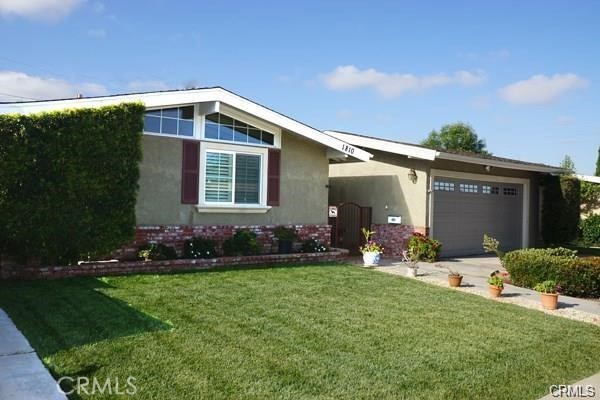 SHORT DISTANCE TO CHAPMAN UNIVERSITY. Welcome to the beautiful City of Orange! This cozy and inviting home, nestled in a desirable neighborhood, offers convenient access to major freeways 55 and 22. Situated near Chapman University, Angel Stadium, Old Towne of Orange, as well as various restaurants and shopping centers, this property epitomizes convenience and comfort. Step inside to discover an open floor plan featuring a charming brick fireplace, spacious living room, dining area, and a well-appointed kitchen. Enjoy the modern amenities of central air conditioning, central heating, and double-pane windows throughout the property, ensuring a comfortable living environment. This move-in ready home boasts a recently upgraded kitchen, complete with elegant granite countertops, new cabinets, and numerous other enhancements. With 4 bedrooms, 2 baths, and interior doors crafted from oak wood, this property exudes quality and craftsmanship. Outside, the sizable backyard is beautifully landscaped, offering ample space for outdoor gatherings and entertainment with family and friends. Don't miss the opportunity to make this wonderful property your new home in the vibrant City of Orange!