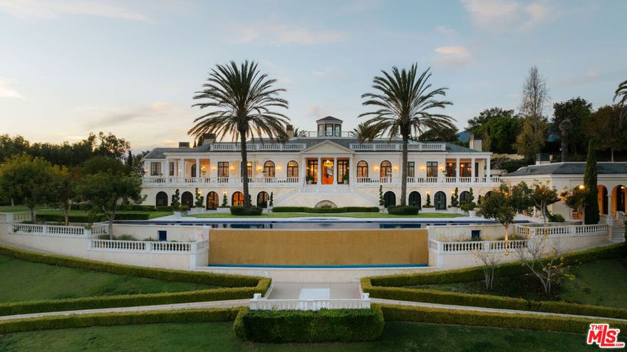 A globally recognized private estate bordering the highly prestigious city of Montecito, this magnificent retreat is sited in one of the most coveted locations on an extremely rare 19-acre lot. This extraordinary estate is a masterful expression of Neoclassical design, drawing inspiration from the refined villas of 18th-century Italy and France. The main residence offers 12 bedrooms and 25 bathrooms, defined by remarkable scale and volume. A striking marble entry hall opens to breathtaking views of the Pacific Ocean and the Santa Ynez Mountains, setting the tone for the home's grand yet livable interiors. Formal and informal living spaces include expansive living and dining rooms, a gourmet kitchen with breakfast area, family room, office/library, and an elite-level wine cellar with adjacent tasting room. Thoughtful design and functionality are seamlessly woven throughout, complementing the estate's natural surroundings. Designed for elevated living and entertaining, the property features an exceptional suite of amenities, including a private cinema, gym, spa, beauty salon, sports bar, ballroom/disco accommodating up to 200 guests, and an Olympic-length infinity pool. A private guest wing and two additional guest houses provide ideal accommodations for extended family and guests. The expansive grounds showcase a regulation-size polo field (approximately 10 acres) with clubhouse, pool house, helicopter hangar with studio lofts, auto gallery, and lush landscaped gardens with streams, ponds, and waterfalls. Recreational features include a 330-yard driving range, putting green, and sand trap, while historic Monarch butterfly habitats gracefully border select outdoor living areas. A rare combination of scale, craftsmanship, and world-class amenities, this magnificent estate stands among the finest private residences ever offered.