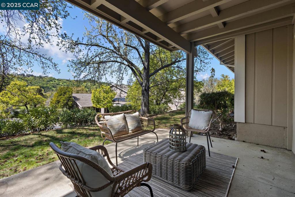 Welcome to the Mariposa, a lovely two bedroom home in Rossmoor, the premier retirement community nestled in 2,000 acres of Walnut Creek, CA. This sweet two bedroom, two bathroom condo has a serene patio with a lawn setting surrounded by nature. The floor plan gives you a sought-after "great room" feel with the Kitchen being open to the Dining Room and Living Room. The all-white Kitchen has a cozy breakfast nook from which to enjoy your coffee while basking in the morning sun. Desirable features abound like updated vanities in both bathrooms, smooth ceilings, shutters, modern light fixtures, and more. New carpeting and fresh paint throughout means you can move right in to this pristine property without doing a thing. And you'll appreciate savings on your monthly energy bills with dual pane windows and sliders throughout and a newer heating and air system. There are only a few gentle steps leading to the front door so it is easily accessible and garage parking is just steps away. Trees and landscaping line this small entry giving you great curb appeal with a ton of guest parking.
