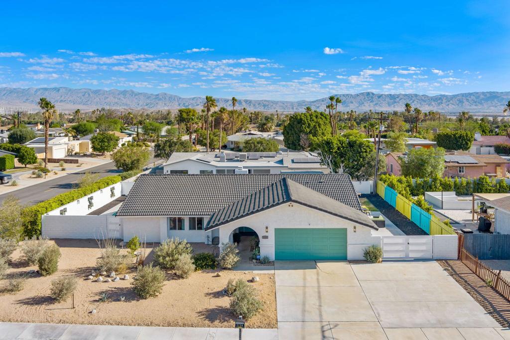 Experience the ultimate Palm Springs lifestyle in this beautifully renovated home that offers superb mountain views from the sparkling pool and spa. Thoughtfully maintained and available turnkey furnished or unfurnished, this property is ready to enjoy immediately--just bring your toothbrush and make it your desert oasis. Designed for comfort and easy living, the home features an open kitchen with a center island that keeps you connected with guests whether indoors or outdoors, while the step-down living room with a fireplace and French doors adds both charm and seamless access to the backyard retreat. Each bedroom comes complete with televisions and linens, and the renovated bathrooms are stylish and move-in ready. The garage has been transformed into a versatile space with air conditioning, a washer and dryer, and a variety of entertainment options, making it an ideal bonus area. Outdoor living is where this home truly shines, offering a covered patio for shaded relaxation, multiple sitting areas, and a stunning pool and spa with unobstructed views of the surrounding mountains. Additional features include dual-paned windows, LED lighting, an alarm system, and convenient RV parking. Perfectly blending indoor comfort with resort-style outdoor amenities, this residence checks all the boxes for a permanent home, vacation retreat, or investment property. With Palm Springs continuing to be one of the most desirable destinations for events, culture, and leisure, this property presents a rare opportunity to own your slice of paradise.