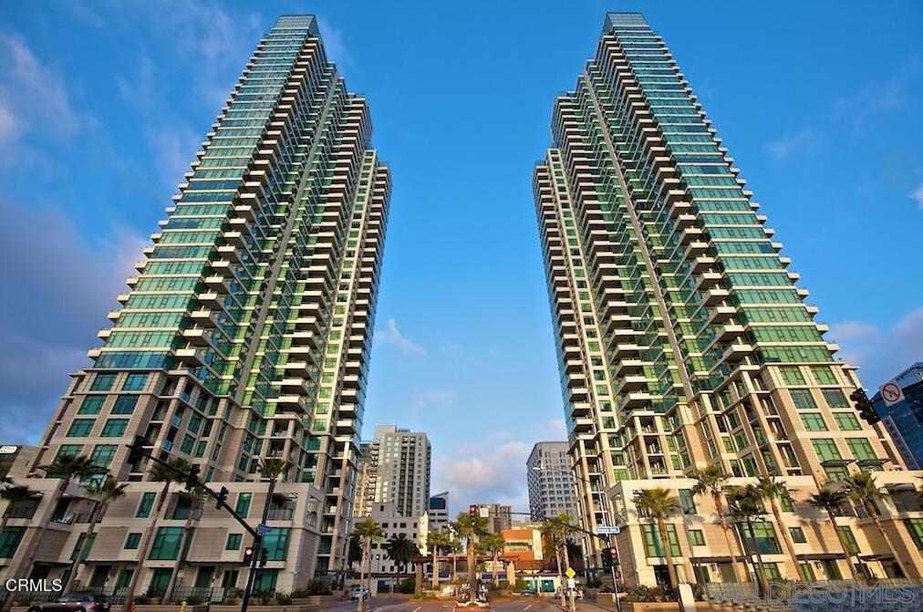 Sophisticated Living in the Heart of Downtown Featuring 2 Bedrooms and 2 Baths and 2 parking (tandem). Offering sweeping city views and a partial view of the harbor. This spacious, light-filled home showcases hardwood floors, granite countertops, and premium stainless steel appliances. Located in The Grande North - one of the West Coast's premier high-rises. Residents enjoy resort-style amenities: 80-ft lap pool, spa, sauna/steam rooms, fitness center, guest suite, lounge, business center, and secure parking. Full-time concierge, package service, and round-the-clock security provide elevated comfort and convenience. Experience luxury living in the heart of downtown.