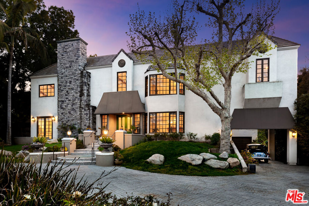 Welcome to a truly magnificent residence nestled within the exclusive enclave of TolucaLake. This regal manor boasts 7 bedrooms and 8 bathrooms across a sprawling 11,075 Sq.Ft., situated on an expansive 26,468 Sq.Ft lot. A circular driveway with an electric security gate on each end is enhanced with a picturesque pond that adds to the captivating entrance, setting the stage for this luxurious oasis. The double-door entry, high ceilings and beautiful French doors further amplify the timeless elegance that fills every corner of this distinguished Toluca Lake estate. A grand 8-car garage accommodates any automotive enthusiast, while exquisite marble, hardwood, and carpeted floors grace the interiors. The spacious chef's kitchen beckons culinary enthusiasts to create and savor. The kitchen is designed for cooking efficiency-providing ample space for meal preparation, cleanup, entertaining guests and hosting gatherings. The primary suite offers a retreat with 2 fireplaces, a serene sitting area, and sauna. Adding to the appeal of this exceptional property is a charming 1 bedroom, and 1 bath guest house, ensuring both privacy and convenience. This impressive residence has a total of 7 fireplaces throughout, promoting a warm inviting ambiance in various living spaces. The backyard features a large grassy area ideal for families and shimmering pool and spa, creating a relaxing haven for both leisure and entertaining. The basement offers ample storage space, and the potential for conversion into an extra room, studio or entertainment area, adding versatility to this already extraordinary property. Close proximity to nearby restaurants and shopping experiences along Riverside Drive, this home offers something for everyone. Welcome home!