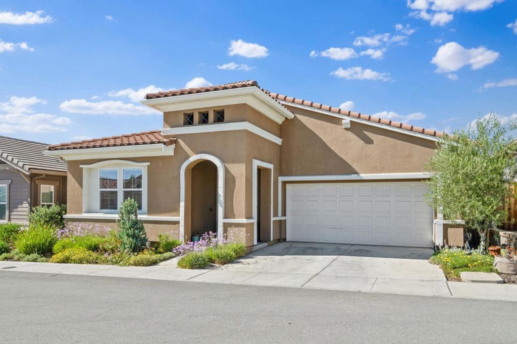 Welcome to this charming residence located in HOLLISTER, offering 1,902 sq ft of comfortable living space on a minimum lot size of 4,075 sq ft. This home features two spacious bedrooms, each with a walk-in closet, and more than one bedroom conveniently situated on the ground floor, including the primary bedroom. The kitchen is a chef's delight, equipped with a gas cooktop, built-in oven range, garbage disposal, and an island with sink, perfect for culinary creations. The dining room offers a breakfast bar and dining area, seamlessly connected to the family room in a kitchen/family room combo. Enjoy the warmth of the fireplace, and the ease of laundry with gas and electricity hookups available inside the utility room. Central AC ensures comfort throughout, complemented by energy-efficient features such as Energy Star appliances and lighting. Residents have access to community amenities, including a heated pool, lap pool, and spa/hot tub. The home is within the Hollister Elementary School District.