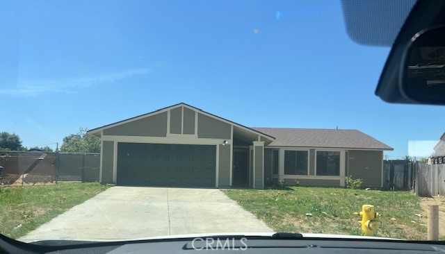 This home has 4 bedrooms and 2 bathrooms, single story home with peek mountain views in the community of Perris! Enjoy high ceilings, an inviting, stone fireplace in the living room, and a spacious floor plan. The kitchen features oak wood cabinetry, a breakfast bar, a breakfast nook, and views to the outdoors. The primary bedroom offers a large closet and a shower-in-tub in the primary bathroom, no carpet throughout. Sliding doors lead to the outdoor patio, back yard, and basketball area. Additional property highlights include ceiling fans, garage laundry hookups, RV parking potential, and no HOA. Convenient to nearby schools, area parks, and easy access to major freeways,