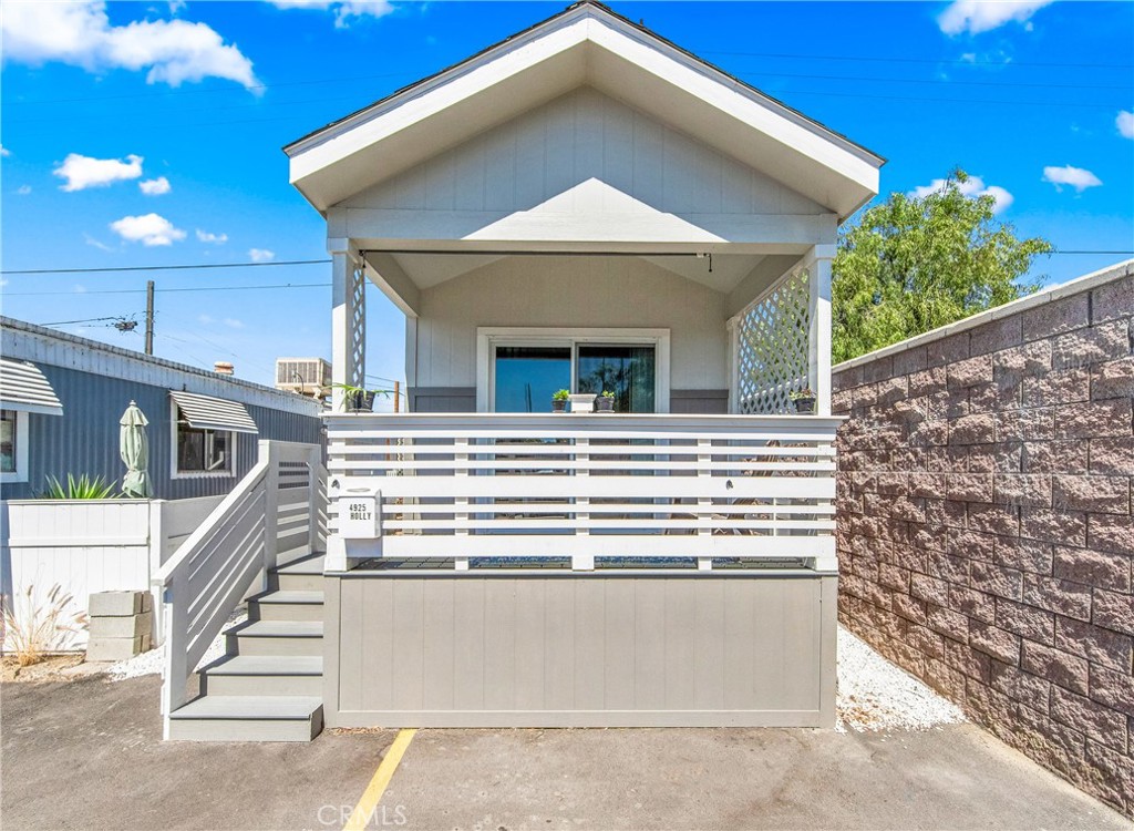 Introducing a modern one-bedroom, one-bath loft at 4921 Holly Avenue, Long Beach, CA, located in a 55 and over community. This 400 sq. ft. end unit, newly built in 2024, features an open floor plan with a kitchen open to the living room, vinyl plank flooring, and a beautiful covered porch. Enjoy assigned parking with two spaces right in front of the unit and access to a pool. The home's side entrance includes a ramp with a bar for easy access.This is the best end unit.  Perfect for contemporary living!
