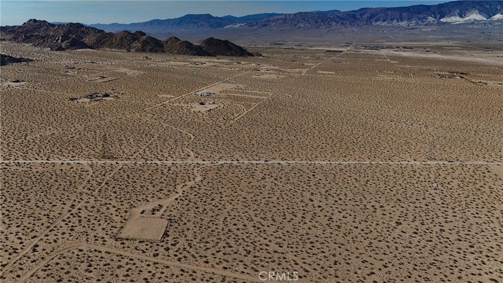 This 5-acre lot sits just 330 feet from thousands of acres of government land that includes the popular Cougar Buttes area, known for off roading, rock crawling, and wide open desert camping. It’s a go-to spot for weekend adventurers with rugged terrain, big boulders, and plenty of space to explore. The property doesn’t have utilities and there’s no legal road access from Powerline Road, which is why it’s priced accordingly. If you’re into off roading and want your own guaranteed camping spot without the crowds, this could be the perfect setup.
This property does not have an address assigned. " 762 Powerline Rd (NEAR)" is for listing purposes only.
APN# 0452-431-12-0000
Coordinates: 34.496287 / -116.842034