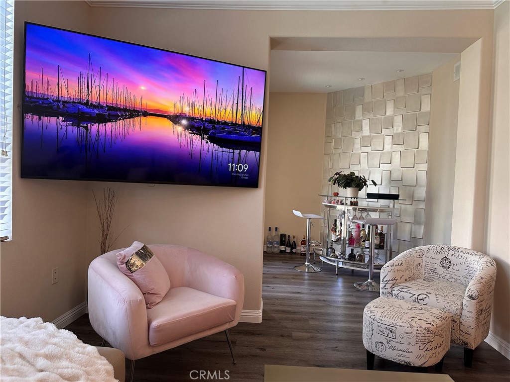 Beautifully furnished 868 sq ft 1-bedroom plus den with wood flooring and a clean, modern design. Comfortably spacious for two, it features a private pool-view balcony, dual-sink bathroom, and walk-in closet. Enjoy 3 pools, 4 spas, sports courts, gym, clubhouse, and theatre. Walk to shopping/dining; minutes to UCI, beaches, and airport. Includes 2 designated gated garage spaces and indoor laundry.