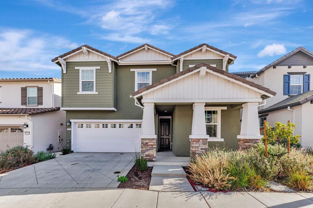 Beautiful, nearly new 5-bedroom, 3.5 bath home nestled in the foothills of Gilroy! Built just one year ago, this spacious residence located in Cadence Community offers modern living in a prime location. Enjoy being down the street from Gilroy Colf Course,1.2 miles from Gilroy Gardens, 1.5 miles from vibrant Downtown Gilroy, 0.5 miles from the scenic Uvas Creek Preserve, 0.4 miles from Christmas Hill Park, and within 3.5 miles of some of Gilroys most notable wineries. The thoughtfully designed floor plan includes a stunning upgraded kitchen with quartz counters, an en-suite bedroom on the main level perfect for guests, plus a separate half bath just off the great room. Upstairs you'll find three additional guest bedrooms, a large laundry room, and an enormous primary suite showcasing breathtaking foothill views. The luxurious primary retreat features a soaking tub, dual vanities, and an expansive walk-in closet. The large backyard is a blank canvas, ready for you to create your dream outdoor space. Enjoy the added benefit of solar energy, epoxy floor in the garage, and EV charging capabilites. Dont miss the opportunity to own an beautifully upgraded, modern home in a highly sought after location with access to Gilroys best amenities right at your doorstep!