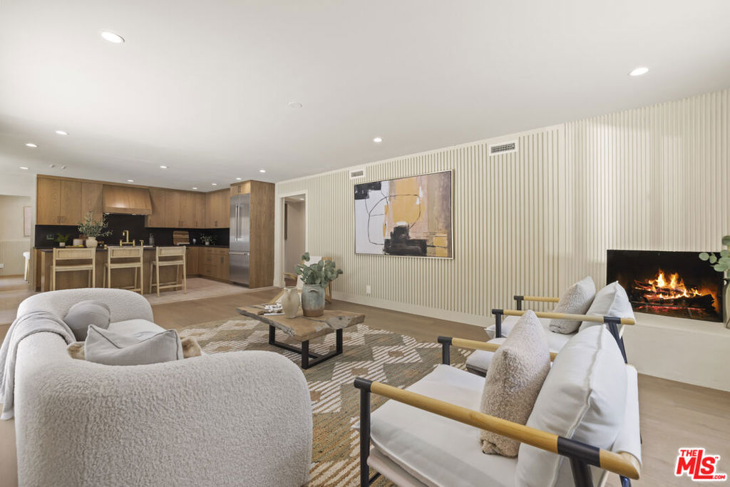 Welcome to this beautifully reimagined modern retreat S of the Blvd in one of Studio City's most exclusive neighborhoods; The Dona's. Located within the coveted Carpenter School District, this home offers a rare blend of contemporary elegance and functionality, with all bedrooms conveniently located on the upper level. Inside, clean plaster walls, rich natural light, and designer finishes create a refined yet comfortable atmosphere. The main level boasts a sunlit living room with fireplace, a formal dining area that opens to the backyard, and a chef's kitchen outfitted with Thermador appliances, marble counters, custom cabinetry, and a center island with breakfast seating. A spacious family room with sliding glass doors enhances the indoor-outdoor flow, perfect for entertaining. Upstairs, the primary suite offers a tranquil escape with a walk-in closet and spa-inspired bath featuring a dual vanity, soaking tub, and oversized shower. The three additional bedrooms are spacious and inviting, and the two bathrooms boast stylish finishes. The private backyard includes a generous patio, flat grassy lawn, and built-in BBQ for effortless outdoor living. This turnkey residence is moments away from Sportsmen's Lodge as well as all of the shopping and dining options on Ventura Blvd. Don't miss out on the opportunity to schedule a tour of this exceptional residence today, welcome home!