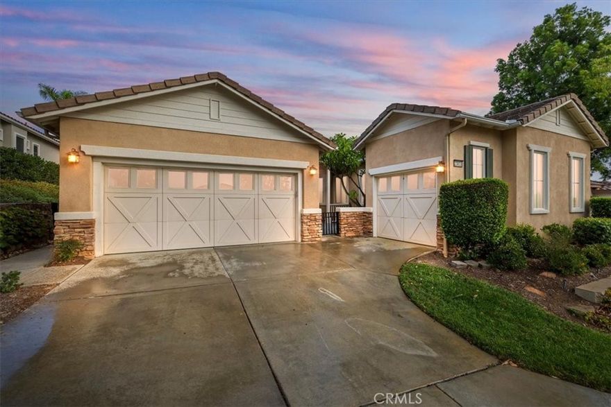 Luxury Resort Living With CAPTIVATING VIEWS. Stunning PALOMAR MODEL Home In The Prestigious Trilogy Glen Ivy 55+ Community. This Three-Bedroom, Three-And-A-Half-Bath SINGLE-STORY Residence With DETACHED CASITA Offers Comfort And Style. Enjoy OPEN-CONCEPT Living With Ten-Foot Ceilings, Wall-To-Wall 18" Porcelain Tile Flooring, Carpet In The Bedrooms, And Panoramic VIEWS Of The Trilogy Golf Course And Santa Ana Mountains. The GOURMET KITCHEN Features Beautiful Granite Counters,  Upgraded Cabinets Throughout, LARGE ISLAND, And Matching Black Appliances. The Primary Suite Boasts Elegant Coffered Ceilings, PRIVATE PATIO ACCESS, An Upgraded Spa-Like Bath With SOAKING TUB, Tiled Shower, And Walk-In-Closet. The DETACHED CASITA Includes Bedroom, Bath, RETREAT SPACE, And An Attached GOLF CART GARAGE. Perfect For Guests Or Flex Space. Step Outside To Your COVERED PATIO Overlooking The Ted Robinson Designed TRILOGY GOLF COURSE, Perfect For Year-Round Outdoor Enjoyment. Explore The Beauty Of The Golf Course, Especially The STUNNING WATERFALL On The 18th Hole Which Creates A Memorable Backdrop For Golfers And Visitors Alike. Residents Enjoy Resort-Style Amenities: Pools, Fitness Center, Tennis & Pickleball Courts, Clubhouse, And More, All Surrounded By The Scenic Glen Ivy Golf Course And Cleveland National Forest.