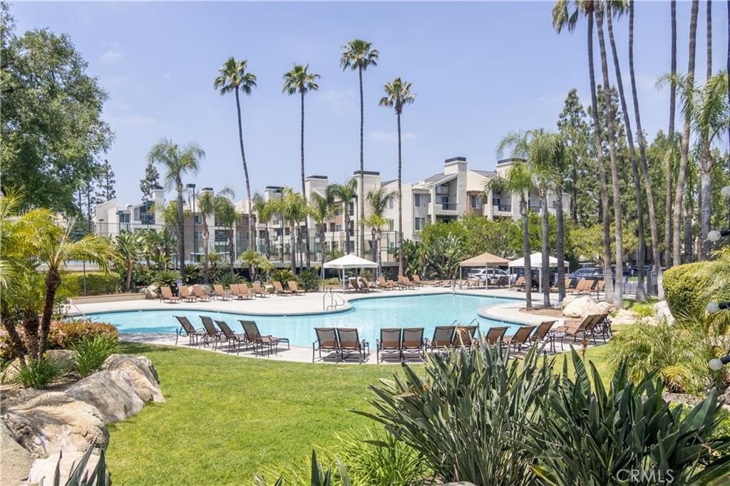 Welcome to The Met at Warner Center a resort-style, guard-gated community in the heart of Woodland Hills! This highly prized 3rd floor (top floor) 2 bedroom, 2 upgraded baths, plus a loft is the premier floor-plan at The MET, that comes with vaulted ceilings, balcony views of the grounds, welcoming natural light from all windows. Upgraded kitchen cabinets and stainless steel appliances, quartz counters all in great shape. All bedrooms are spacious and the loft is an added bonus living area not found in lower units. The unit is equipped with Central Air-conditioning and comes with all appliances including refrigerator, washer & dryer, and total of 2 assigned parking spaces which one is located outside(not covered) and another one inside (covered) under the building. There are four swimming pools, tennis courts, racket ball court, a basketball court and rec room. A truly resort style living. Finally with 24 hour guard gated security, one can feel safe in this proud community. Located in walking distance to the Village, local park, shops and entertainment. Living in the heart of the Warner Center can give you an incredible quality of life.