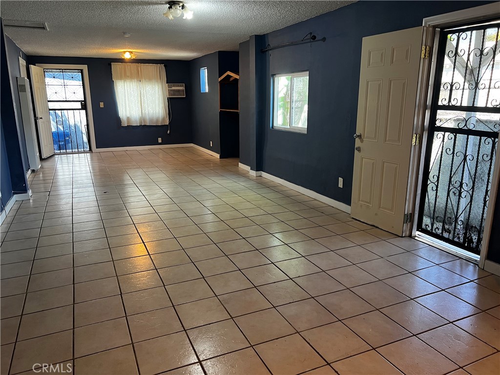 Back unit of the Triplex located near parks, schools, shopping plaza, and major public transportation is for lease. Property has been updated with kitchen counter tops, restrooms, newly painted. Fruit trees and plants surrounds the property. Back carport has parking for 2 vehicles and additional space for storage.