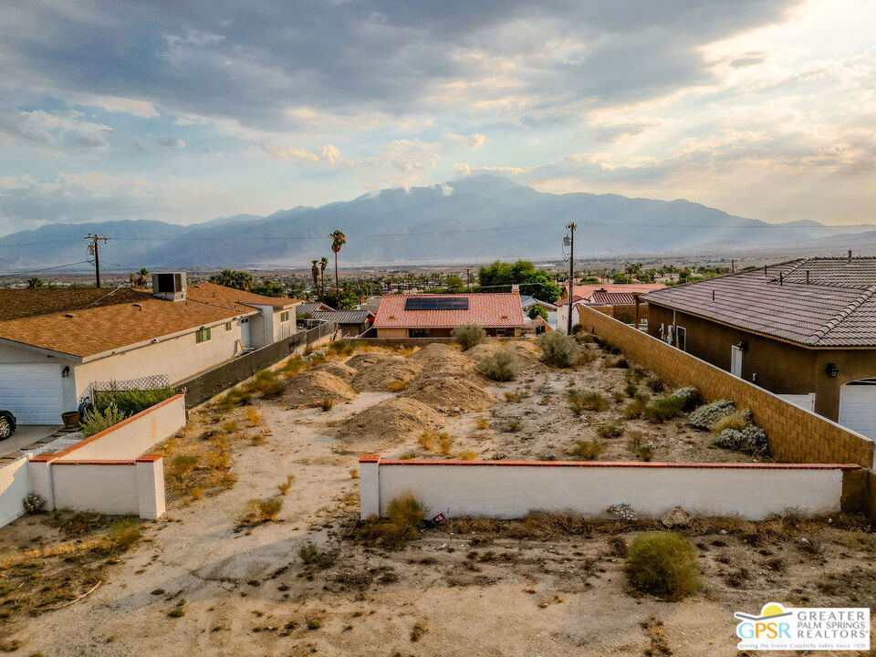 Prime Residential Lot with Mountain Views! Discover the opportunity to build your dream home on this 7,841 square foot residential lot in desirable Desert Hot Springs. Framed with a stucco wall at the front, this lot is further enhanced by a block retaining wall belonging to the neighboring home to the right and a fenced boundary belonging to the home to the left, providing both definition and privacy. The lot's elevated position offers sweeping views of the valley and surrounding mountains, making it an ideal setting for a custom build. Located within the Palm Springs Unified School District and zoned R1, the property is minutes from local amenities, spas, dining, and just a short drive to downtown Palm Springs. Whether you're an investor or looking to create your personal retreat, this parcel offers endless potential in a growing community.