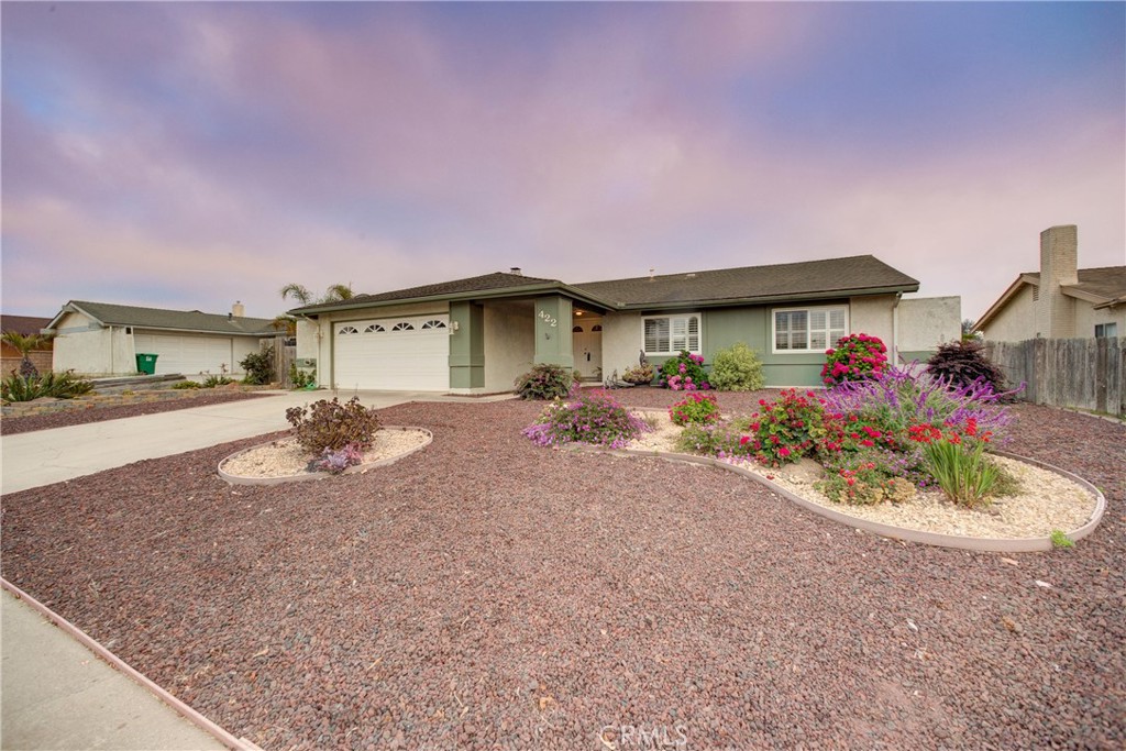 Welcome to 422 Highland Drive in the heart of highly desirable Orcutt, where charm, space, and potential converge. This beautifully maintained 4-bedroom, 2-bath single-level home offers an impressive 2,035 sq ft of thoughtfully designed living space on a generous 8,200 sq ft lot.
Step inside and feel instantly at home in the expansive step-down living room featuring wood beam ceilings and a wood-burning fireplace with a striking stone surround—perfect for cozy evenings or hosting loved ones. The kitchen offers classic charm with Corian countertops, two-tone cabinetry, and a small pantry, flowing naturally into the dining area and out to a light-filled sunroom with new carpet and heating—an ideal spot to soak up the sunshine and enjoy hillside views from the elevated backyard.
The south-facing backyard is a blank canvas, ready for your vision of an outdoor oasis. Enjoy stunning panoramic views of the surrounding Orcutt hillsides and mountains, where you can take in beautiful sunrises to the east and colorful sunsets to the west—all from the comfort of your own private space.
Down the hall, you’ll find two secondary bedrooms, one with French doors and the other with vintage wallpaper, mirrored closet doors, and built-in lighting. The hall bath includes a large vanity, tile countertops, a separate shower and tub, and a solar tube for soft, natural light.
The massive primary suite is a true retreat—extended with permits to include an additional 144 sq ft. It features a spacious walk-in closet, en-suite bath with walk-in shower, and a bonus space with its own access point—perfect for a home office, nursery, sitting area, or even a potential 5th bedroom with the addition of a door.
The front yard offers mostly drought-tolerant landscaping for easy upkeep, accented by vibrant hydrangea blooms that add a cheerful pop of color and enhance the curb appeal.
Additional perks include a 2-car garage, two versatile sunrooms, and a quiet location near top-rated Orcutt schools, beautiful parks, hiking trails, local wineries, and the charming Old Town Orcutt district with restaurants, shops, and community events. Plus, with easy access to Highway 101, you're just minutes from Santa Maria and a quick drive to the Central Coast's stunning beaches.
Don’t miss this special opportunity to own a spacious, flexible home in one of Orcutt’s most sought-after neighborhoods!