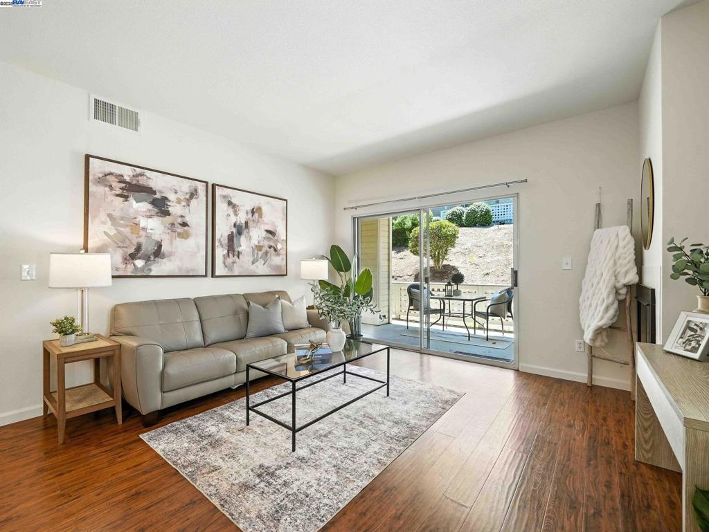Beautiful, bright and airy, 3-bedroom, 2-bath single-story, end unit condo in the highly desirable Bravo community! Freshly painted throughout, this open floorplan includes laminate flooring in the main living areas, cozy carpet in the bedrooms, and a gas fireplace in the living room. The kitchen features quartz countertops, matching s/s appliances, and ample cabinet space. The spacious primary suite includes direct access to the patio, a generous closet, soaking tub, Jack-and-Jill sinks, and updated light fixtures. Two additional well-sized bedrooms offer flexibility for family, guests, or a home office. Enjoy two access points to the expansive private patio—one from the living room and one from the primary suite—plus an outdoor storage area. Detached 1-car garage included. The community offers a peaceful hillside setting with access to a pool, clubhouse, nearby parks, and scenic hiking and walking trails. Located within walking distance to Hanna Ranch Elementary school and close to shopping, dining, and commuter routes including Highways 80 and 4. HOA covers water, trash, and exterior maintenance, making this home both low-maintenance and lifestyle-rich.