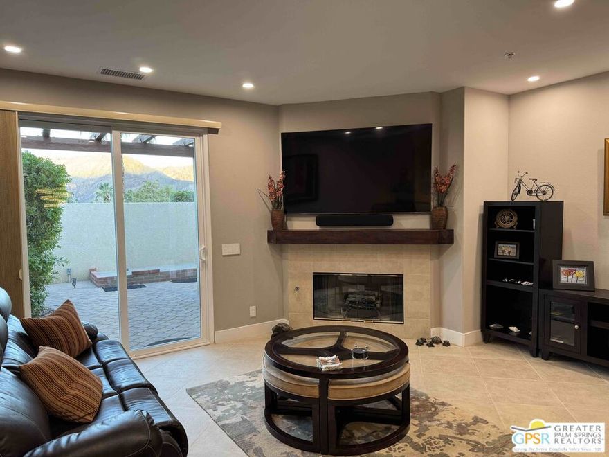 Spectacular Mountain Views from the west facing gated courtyard/patio. Watch the Long Horned Sheep meander down from high above. This lovely 3 Bedroom 3 Bath condominium home includes it's own Casita with private courtyard access which includes a private bath ensuite - perfect for visiting guests or extended living arrangements. The enormous Great Room with vaulted ceilings features a Gas Log Fireplace with large TV above the mantle - a truly popular area for intimate evenings or hosting large events and parties. The dining area features a custom chandelier - very whimsical - with direct visuals into the large kitchen space. Newer double ovens and dishwasher and the massive Refrigerator/Freezer compliment this galley kitchen with an island. Beyond the kitchen is the Laundry room with a sink and then beyond that area, is the Casita with it's own entrance and private bath ensuite. Upon entering the home, at the front door, you are welcomed by the open Great room with the Dining Area to the left, straight ahead is the Living Room area with the gas-log fireplace and over sized TV and then to the right of the Great room is the Primary Bedroom Suite. With a "Loretta Young" double door entry and exceptional detail, this suite is huge with a large closet to take a stroll in and visiting the recently updated primary bath ensuite including the huge soaking tub, dual vanities, water closet and an enormous multi-person stall shower. Incredible! To finish off this main bedroom wing of this expansive home is the hall bath that is used as a third bath for the 3rd bedroom that is currently used as a home office or the guest bath used during get-togethers and special events. Besides the huge outdoor patio at the entry to this home, there are also access points to smaller more private patios - one off the Living Room and one off the Primary Bedroom. And finally, this home features access to it's own private 2 Car Garage and plentiful guest parking. What a great property to call home. Canyon Heights features a myriad of pools and spas, tennis courts and a Clubhouse. Easy to show, schedule your personal tour today!