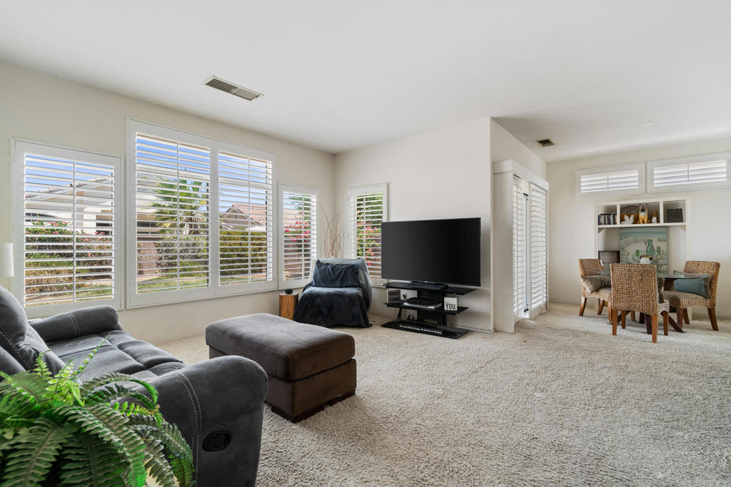Located in the Sun City Palm Desert community, this charming Limoges model offers one bedroom with a convertible den and two bathrooms, ideal for both full-time residence or seasonal retreat. Built in 1994, the home features approximately 1,045 sq. ft. of well-designed living space. Step into a naturally lit, open-concept interior where the living, dining, and kitchen areas flow seamlessly. The thoughtfully designed layout includes a bedroom suite, equipped with ceiling fan, plantation shutters, and a walk-in closet. The den can also be used as a guest space, conveniently located near the 2nd bathroom, perfect for visiting family and friends. Enjoy the private, north-facing backyard with desert-friendly landscaping, a place for a small grassy area and a covered patio - ideal for relaxing or entertaining outdoors. The washer and dryer area is located in the two car garage. The home is being sold as a 'fixer' and needs flooring, paint (inside and out) landscaping, some plumbing and a good handy person. Sold 'as is' and estate will do no repairs or LEC work.Sun City Palm Desert is a premier 55+ gated community offering resort-style amenities such as two 18-hole golf courses, three clubhouses, multiple dining options, swimming pools, fitness centers, tennis and pickleball courts, bocce ball, a softball field, dog parks, and an 18-hole putting course.