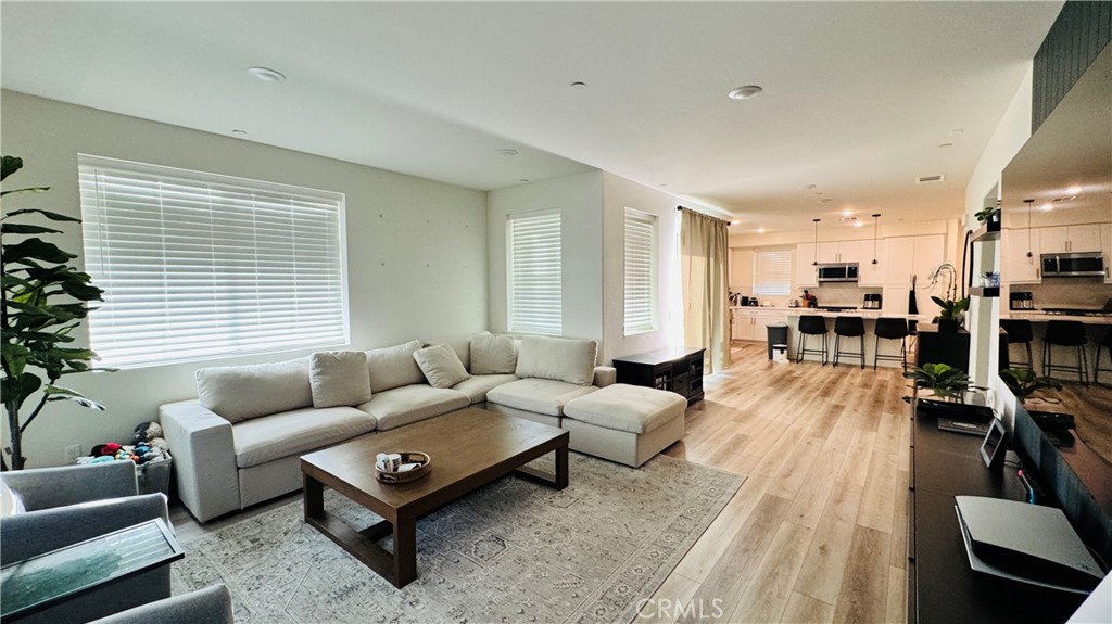 Welcome to Carson Landing, a vibrant, new gated community featuring coastal-inspired designs, a wealth of amenities, and a prime location ideal for enjoying L.A., Long Beach, and Orange County. This expansive top-floor layout offers a penthouse-style experience, complete with white thermofoil cabinetry with soft-close hinges and stainless steel appliances. Simply White Quartz countertops extend throughout, complemented by an upgraded kitchen backsplash. The home is finished with large-format luxury vinyl plank flooring, premium carpet, and tile. Relax or entertain on your private deck. Carson Landing provides easy access to the 91, 710, 110, and 405 freeways, with Cal State Dominguez Hills, Dignity Health Sports Park, Harbor UCLA Medical Center, and plentiful shopping, dining, and recreational options nearby.