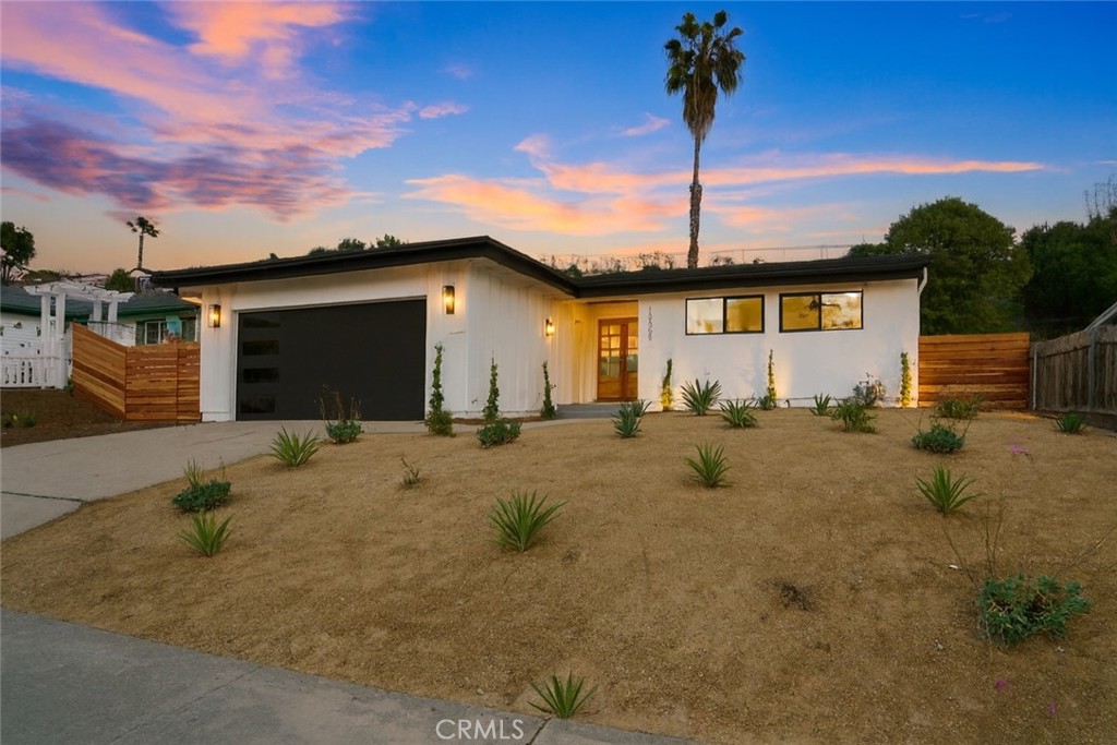 Welcome to 13455 Carriage Road, an absolutely gorgeous home located in the heart of the highly desired neighborhood of Poway. Tastefully remodeled and sitting on a private lot, this home features a rare layout with 2 master suites, a new roof, new windows, stunning engineered hardwood floors, custom landscaping, a new custom garage door, sleek lighting, a new stainless steel appliance package, the most modern fixtures and the list goes on and on!!! From the tastefully designed living room that flows beautifully with the custom kitchen, to the luxurious bedrooms and artfully crafted bathrooms, one will immediately fall in love with this home! The open concept design is truly amazing and allows for effortless living, both indoor and out. Leading into the backyard, you will find a huge wrap around yard accompanied with a spacious concrete patio area, all surrounded by gorgeous trees and plants offering privacy. This backyard is absolutely perfect for entertaining. Located right next to schools, parks, shopping centers and more yet tucked away in a quaint and quiet street. Don't miss out on this rare opportunity!