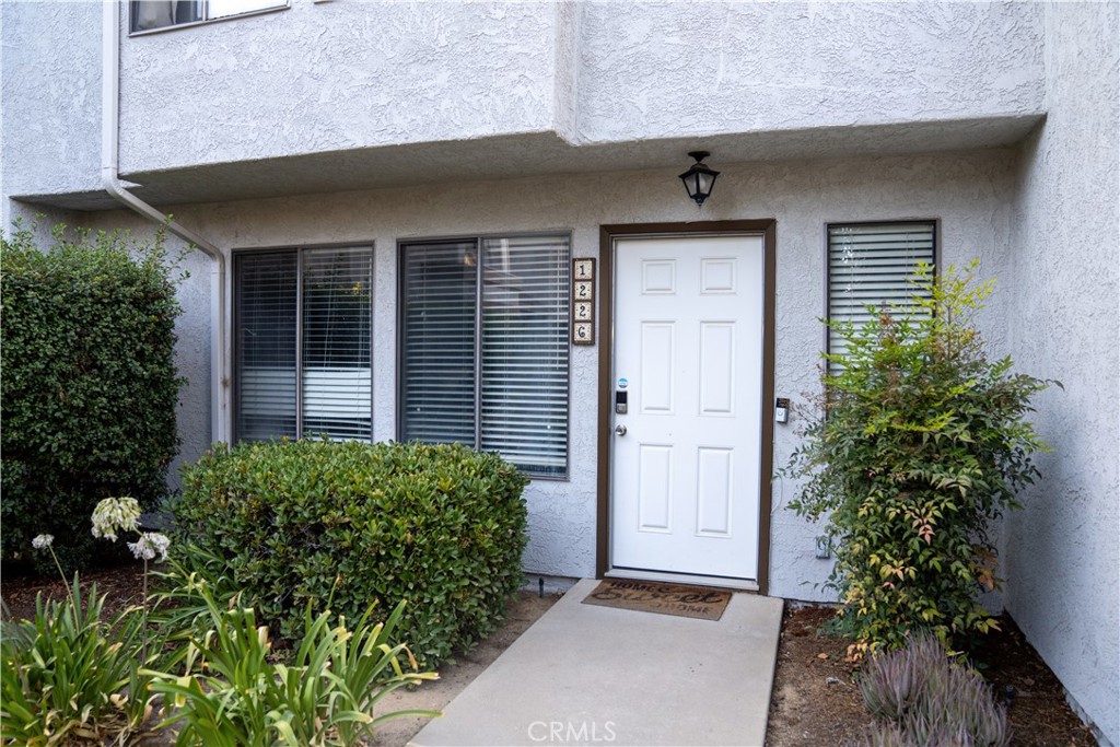 I am pleased to welcome you to 1226 Calle De Campo. Calle De Campo is a small street located within a quaint neighborhood that is surrounded by beautiful trees. There are many unique features - but the ones that stand out the most are the two large master suites, walk-in closets, both master suites were built with privacy in mind. The vanity rooms are separated from toilet, shower and bathtub. Master suites are located on the second level of the home. On the first floor is the living room, dining room, half-bath, laundry room and kitchen. The home has many upgrades: Granite counter tops, stainless steel appliances and tile throughout. There is a private patio in the back that leads to an oversized two-car garage which also includes a LEVEL 2 CHARGER FOR ELECTRIC CARS. And for convenience, the home is located near the community club house and swimming pool.