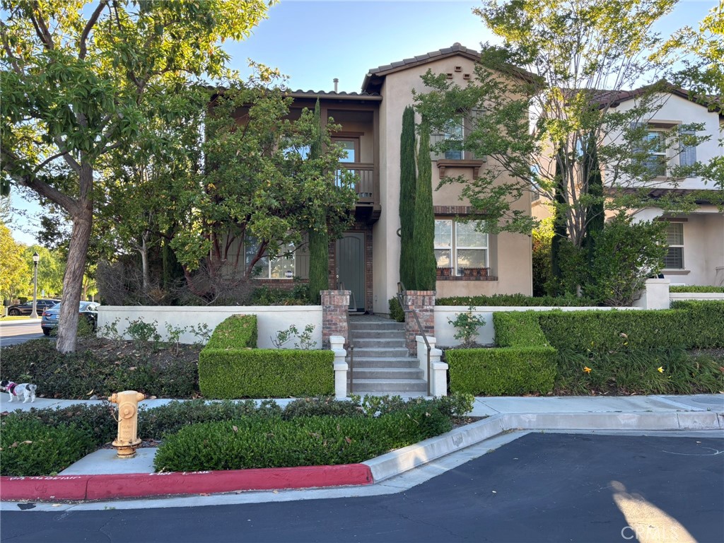 Welcome to this beautifully upgraded 4 bedroom and 3 bathroom gorgeous homes you will find in the sought after Pasadera community. Desirable corner lot with a wonderful garden, built-in barbeque, stone fireplace and lush landscaping. Home is perfect for entertaining your family and friends. Striking curb appeal with fountain and custom hardscape. The popular floorplan features a main floor bedroom upgraded with custom cabinets. The gourmet kitchen is every cook’s dream featuring upgraded Thermador appliances including 6 burner gas cooktop, beautiful granite counters, large center island, upgraded cabinets and custom wine bar. Dining area features fireplace and custom lighted cabinets. Beautiful wood floors enhance the main floor living space. All doors throughout the home have been upgraded to solid wood. All bedrooms include custom cabinets. Don’t miss the huge walk-in master bedroom closet. Home is wired for a security system. Garage features custom cabinets and epoxy floor. All residents have access to two community pools and exercise trail. HOA includes Social Membership to the Aliso Viejo Country Club.