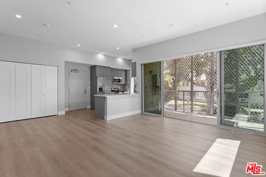 Unit comes with its own front facing balcony!!!   Parking Included. Gated building. In unit Laundry. Balcony. BRAND New Building. Welcome to this just-finished, contemporary-modern 1bed, 1bath residence located in the heart of prime West Hollywood. Step into a beautifully designed unit where natural light floods through oversized windows, highlighting the sleek modern wood flooring and open-concept layout. The expansive living room flows seamlessly into a stunning kitchen featuring quartz countertops, modern cabinetry, and stainless steel appliances, including a dishwasher. Recessed lighting throughout enhances the clean, modern design, while the in-unit washer and dryer offer ultimate convenience. Both bedrooms are spacious with ample hanging and storage space. The bathrooms feature elegant modern finishes, including a beautifully tiled shower and excellent lighting. Additional perks include generous pantry and closet storage, plus covered parking. Be among the first to live in this brand-new building  schedule a tour before these exceptional units are gone!