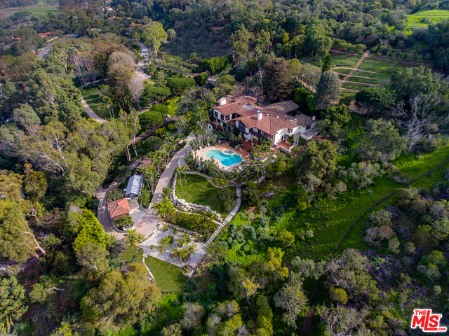 Tucked away on a private cul-de-sac and situated on 3.3 pristine acres, the King of the Hill is one of South Bay's largest and most majestic estates. A dramatic gated entry winds to a stone rotunda guardhouse with historic castle doors. A stone and wood bridge leads to an impressive motor court complete with waterfalls and lush gardens. Stone pathways are lined by exotic plants, fruit trees and grassy lawns. Boasting appr. 9,000sqft of living space, this Spanish Colonial masterpiece is grand yet comfortable with breathtaking ocean and coastline views from most rooms. Upstairs is a spectacular living room, a striking music room, an elegant dining room and a remarkable master-suite with dual baths and private office. Downstairs, the paneled billiard room leads to the expansive guest suites, wine cellar and massage room. The sun-drenched pool and spa also enjoy panoramic ocean and hillside vistas. Family owned for the past 40+ years, are you the next guardian of this extraordinary estate?