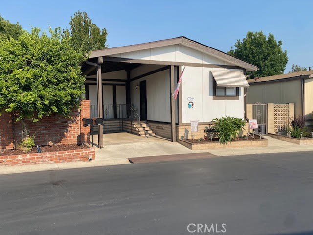Great home in Lake Park Brea's VILLAGE area - 2 BR and 2 Baths - Fresh LVP flooring throughout - Two Skylights with Power Shutters - Nice sized Kitchen with eating bar and roomy Pantry- Large Living Room has vaulted ceilings and Great access to your private yard and covered patio - The Dining Room has a large Built-in Hutch - The Main suite has a dressing area and it's own easy step-in shower - The Guest Bedroom is bright and has access to the Patio - the second/Guest bath also has a tub/shower combination - There's a nice Laundry room with connections for full size washer and dryer PLUS extra cabinets and a built-in desk area - The fully covered patio is elevated to make using it more enjoyable - There's even a lower Yard for more privacy or a place for the grandchildren or pets to play - The Patio area is roomy enough for a Barbecue with Friends - The side Yard would be great for a small garden for those who wish to grow their own fruits and vegetables - The Carport will keep your car, truck, or even a golf cart covered and out of the weather - at the end of the carport is an area for storage - Relax as the HVAC is newer and the Roof is just a few years old - There's a short stroll to the Lake, Clubhouse, Pool, Exercise, or Billiard rooms - A Library and game room are also located in the clubhouse - Guest parking is just a few steps away - Alongside the front of the home is a section of yard for additional plants or other use - Enjoy the cool afternoon breeze while others are walking their pets around the Park or driving by in their golf carts - Stroll the Scenic greenbelts and winding walkways throughout the Park which lead to the Sparkling Lake and Clubhouse nearby - Enjoy your Leisurely Lake Park Lifestyle! Fun includes: Parties in the Recreation Pavilion, Bingo, Bunco, Fishing, Library, Billiards, Exercise Room with newer equipment - Dinner Events - Potlucks, Casino Outings, Pool & Spa, Tennis, Pickle-ball, Seasonal Parades, and more!