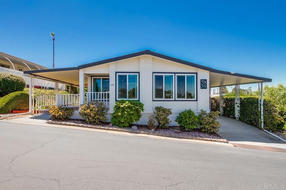 Wonderful home in highly desired Palomar Estates West. The open floor plan and vaulted ceiling throughout the home make this home feel very spacious. Enjoy the peekaboo ocean views or add a window to take advantage of even more views. The master bedroom has a walk-in closet, on-suite bathroom, and attached enclosed porch/California room. This home has great exposure to the westerly ocean breezes. The dual-pane vinyl windows and slider will keep this home comfortable in the temperate San Marcos climate. Palomar Estates West is a 5 star 55+/35+ senior rent controlled park with many activities and amenities including a beautiful clubhouse, pool, spa, gym, putting green, pickleball courts, and tennis courts. This home is located minutes to Lake San Marcos dining and golf as well as local Carlsbad beaches, shopping, and restaurants.