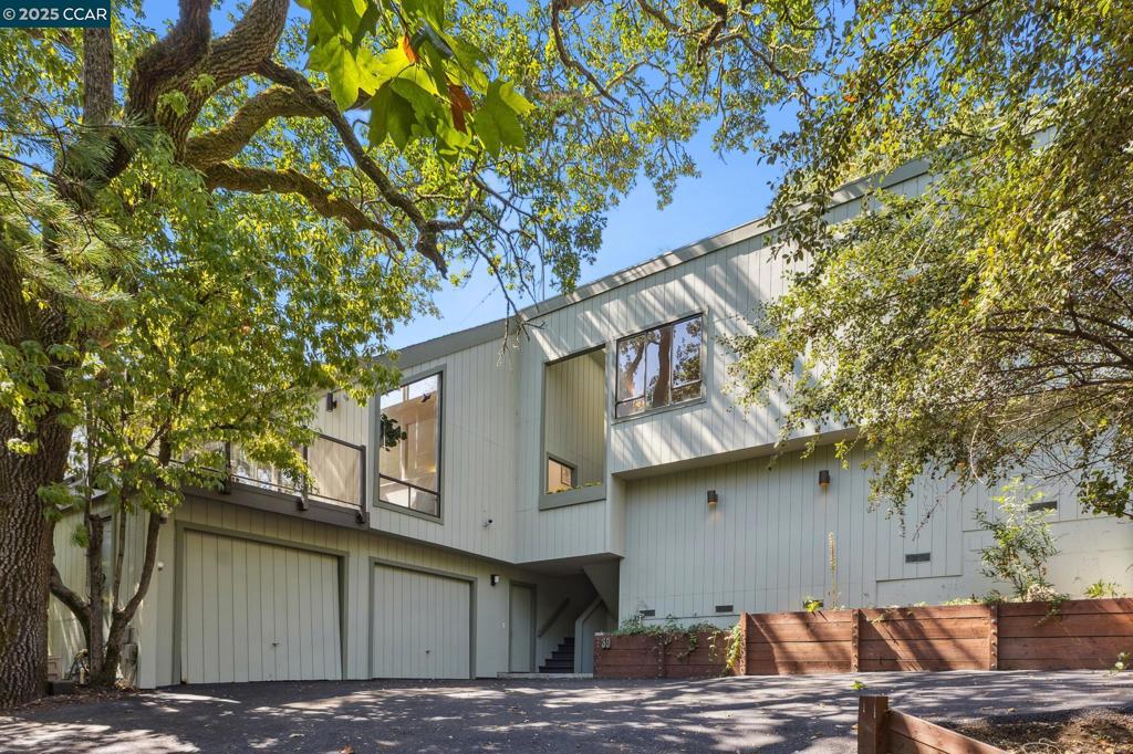 2462 square feet, 4 bedrooms, 2.5 bath located on .51 ac in North Orinda, built in 1977. Nestled within nature and Oak trees, with privacy and unique gardens, offering multiple entertainment decks and a flat outdoor yard to enjoy. Light pours into the living spaces with huge Cathedral ceilings in the living room that extend up to the kitchen and dining room. A wood burning fireplace anchors the spacious living room that leads out to a sitting deck amongst the trees. Up a few steps there is a well-appointed open kitchen with new appliances and an island and plenty of cabinetry, that leads to an open dining room. Access from the kitchen leads to another magical deck with plenty of space for dining and entertaining among nature. Walk down a few steps and there is a large flat garden area that can be landscaped as you wish. A large Primary ensuite with views and an additional two, well sized bedrooms are down the hallway, complete with a laundry room. Downstairs is a large bedroom or bonus room with a half bath. Brand new quality carpet, refinished wood floors, freshly painted inside and out, original owner, this is the first time on the market and a true find Literally minutes to the freeway, downtown Orinda, with a bus stop at the end of the driveway. Miramonte HS.