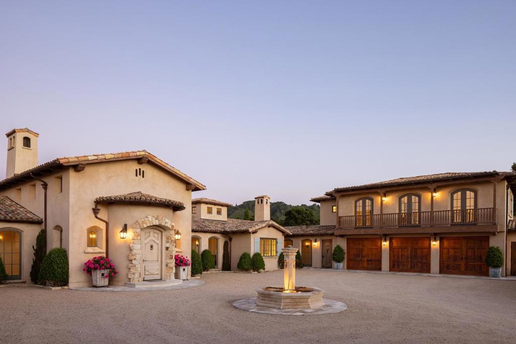 This predominantly single-story estate stands on its own private ridge-top on 49+ acres and is perfectly situated to maximize spectacular, vast blue sky and unique valley and mountain views within the Santa Lucia Preserve. The premier property is accessed via a long, picturesque driveway and includes an expansive, welcoming front courtyard, extensive terraces for seamless indoor/outdoor entertaining, a fully fenced, level yard with putting green and croquet court, a charming garden with mature citrus trees and separate dog-run. This exquisitely detailed home is filled with natural light and includes breath-taking views from the gracious foyer throughout all rooms - formal living and dining rooms, family room, breakfast room, open chefs dream kitchen, office, billiards room, and mud room. The estate is zoned as full-time equestrian and has room to include a barn, guest house, caretakers cottage and infinity edge pool, if desired. Located only two miles from the Preserve front gate within a most desirable microclimate, this one-of-a-kind property is an oasis of elegance and privacy.