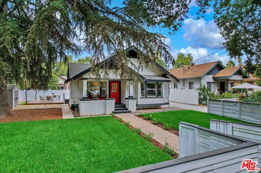 Welcome to this beautifully restored Contemporary Craftsman in the heart of Pasadena. Thoughtfully updated to blend original architectural charm with modern-day convenience, this timeless home offers style, comfort, and easy living. A classic front porch greets you, overlooking the grassy front yard and inviting you into a warm and light-filled interior. The open-concept layout includes a spacious living room that flows seamlessly into the well-appointed kitchen, perfect for both daily routines and entertaining. Hardwood floors add warmth throughout, while three generous bedrooms and two stylish bathrooms provide flexibility and comfort. Step outside to your own private backyard retreat featuring a large deck and a lush green lawn, ideal for al fresco dining, weekend gatherings, or simply relaxing in the sunshine. The property is fully gated with a charming front gate and a tall, secure backyard enclosure that enhances privacy and curb appeal. Located in a quiet residential neighborhood just a mile from the vibrant new scene along Lincoln Avenue including HomeState, Highlight Coffee, and Perry's Joint. A short drive brings you to the Rose Bowl, Old Town Pasadena, and a host of shopping and dining destinations. Don't miss this move-in-ready Pasadena gem.