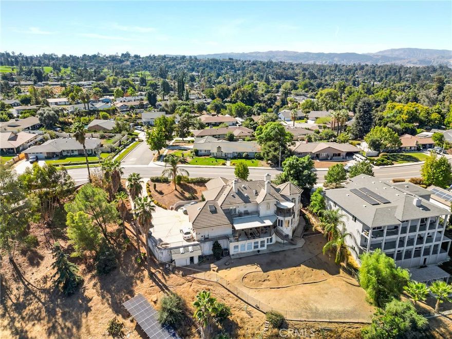 Breathtaking Mountain & City Views! Nestled on one of the most prestigious streets in South Redlands, this stunning home offers nearly 5,000 square feet of luxury living space on a sprawling 1/2-acre lot. Enjoy panoramic mountain views during the day and glittering city lights at night. With plenty of room to build an infinity pool or garden, the possibilities are endless. The home features a 3-car garage with direct access, as well as a fully equipped ADU on the lower level, providing both convenience and versatility. Ideally located near Redlands Country Club with easy freeway access, this residence is designed for both comfort and entertainment. Three fireplaces and three levels of expansive patio areas make it perfect for hosting or relaxing.
