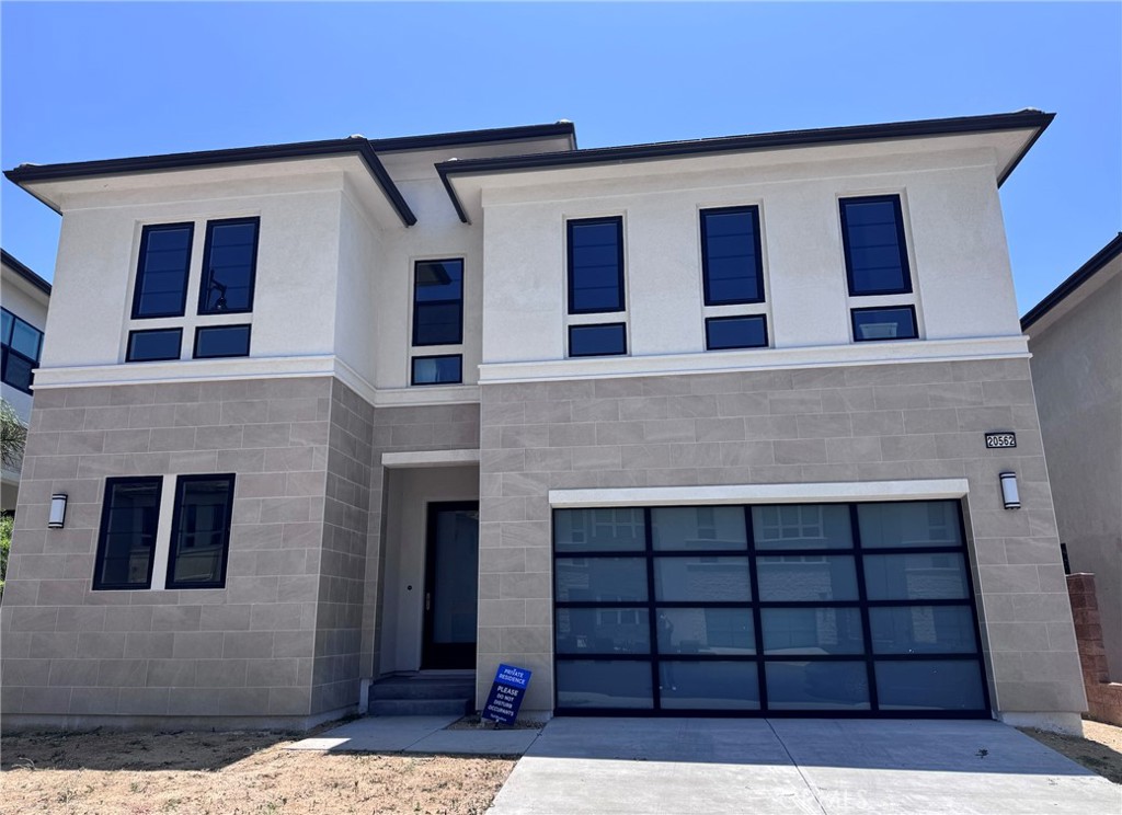 Welcome to the luxurious guard-gated community at Porter Ranch. This stunning and all band new house,first-time to lease out. five-bedroom, 4.5bathroom home boasts 3,7803square feet . The ground level features beautiful wood flooring throughout. The first level features a living room, a downstairs bedroom suite with its private entrance, a powder room, an additional flex bedroom (beyond the already five bedrooms), and a gorgeous kitchen that opens up to the family room. The modern kitchen is a chef's dream with plenty of cabinets, a walk-in pantry, a refrigerator, a microwave oven, and a 6-burner stove. A breakfast island is also ideal for preparing meals, and a dining area is conveniently located adjacent to the kitchen. On the second level, you will find a loft, a primary en-suite with a custom walk-in closet, and a spa-like bathtub, undoubtedly a highlight, offering the utmost relaxation with its stand-alone tub and dual shower. There are three additional bedrooms upstairs and a laundry room that provides both a washer and a dryer. Sliding doors lead to a covered patio and a low-maintenance yard, beautifully landscaped, perfect for those summer nights. You'll also enjoy easy access to the new Vineyards shopping, dining, a movie theater, banks, medical offices, award-winning schools, hiking trails, and the freeway.