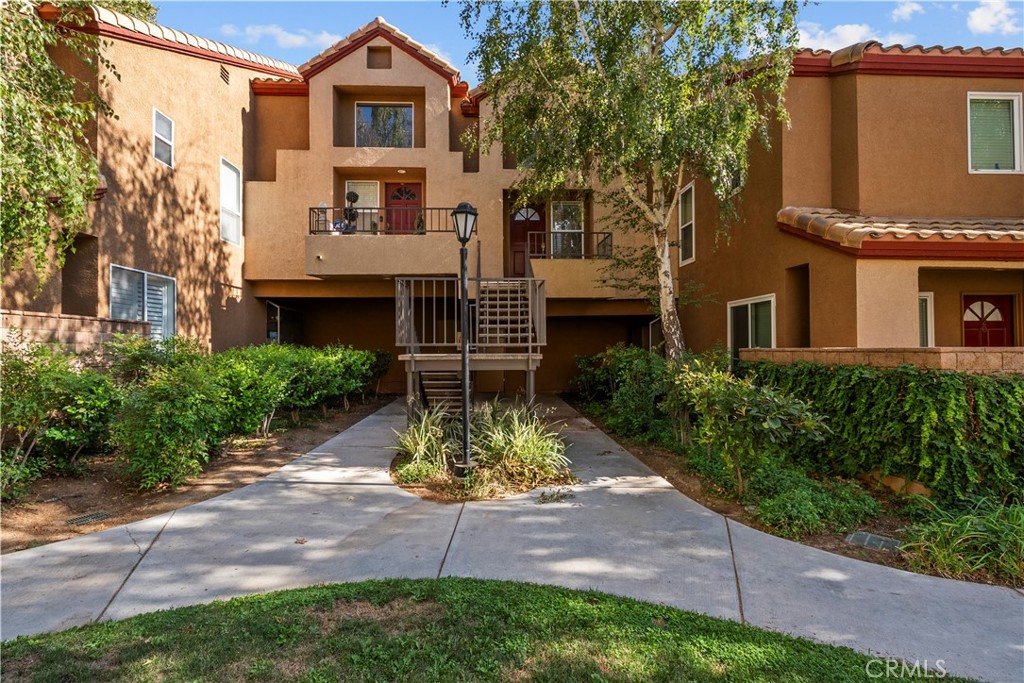 Welcome home to this beautifully updated upstairs 2-bedroom, 2-bath condo with a versatile loft in the sought-after gated Mountainview Villas community. Recently upgraded with light wood-style flooring, fresh interior paint, and a brand-new AC system, this home blends comfort, style, and convenience. Step inside to an open, airy layout featuring soaring ceilings and abundant natural light—perfect for both everyday living and entertaining. The inviting living room has a cozy fireplace and flows seamlessly into the dining area, where a sliding glass door opens to your private patio.
The spacious loft upstairs offers endless possibilities—ideal for a home office, reading nook, play room, home gym or guest space. The primary suite includes a walk-in closet and a ensuite bath with dual sinks, and separate shower toilet area. A second bedroom is conveniently located near the full hall bath with bathtub/shower combo, along with a laundry closet complete with a stackable washer and dryer. Directly below, your private two-car garage offers secure parking and ample storage. Mountainview Villas is both FHA and VA approved and offers resort-style amenities, including a pool, spa, and secure gated entry. Perfectly located near shopping, dining, and award-winning schools, this home is ready for you to make it your own and start creating lasting memories.