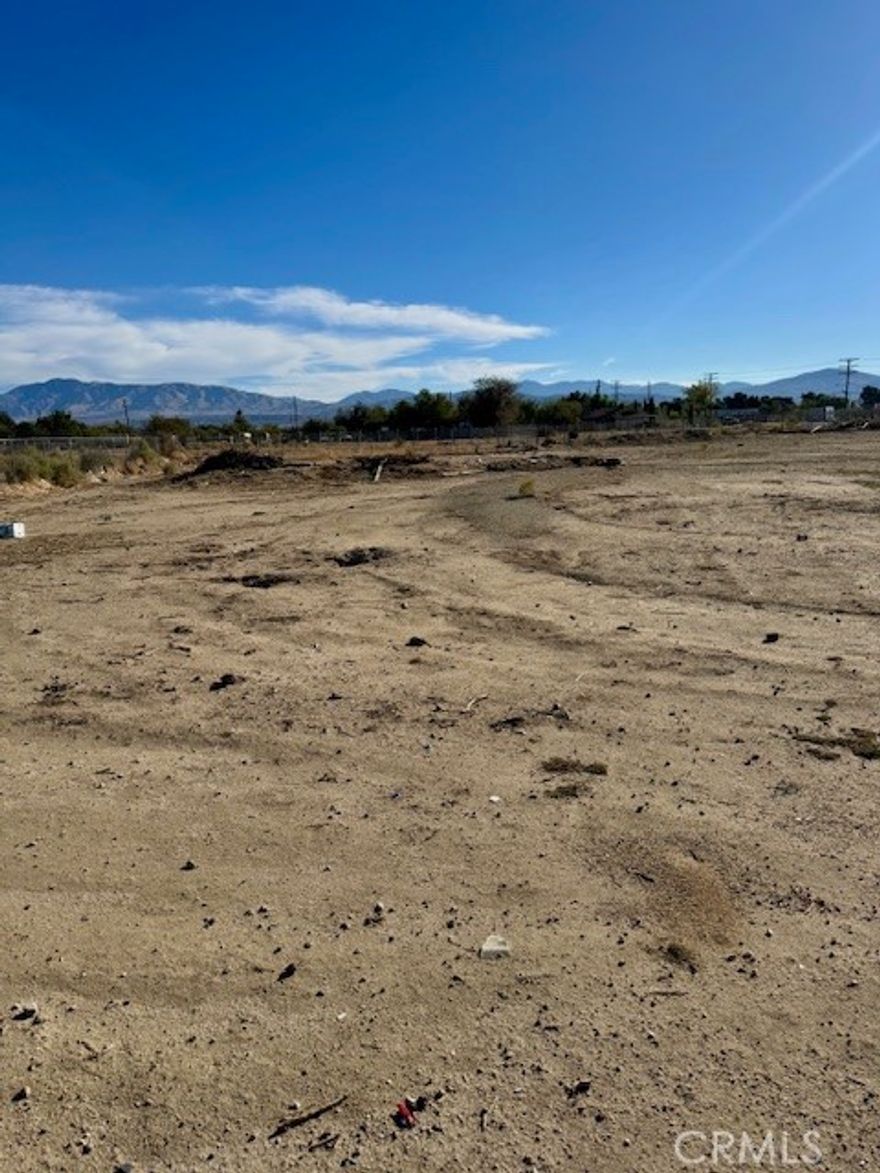 Opportunity awaits with this almost an acre lot on a commercial zone, this flat lot is conveniently located on a busy street offers excellent potential for a variety of uses, Located on a paved public road with water access and electricity running along the street frontage, this property is ready for development.