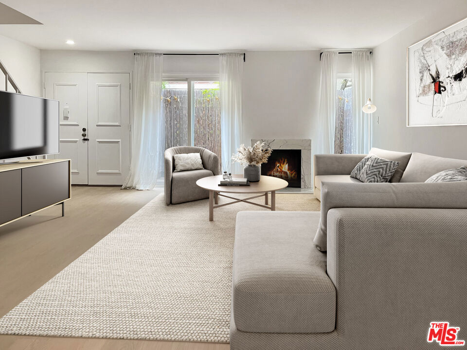 Discover contemporary living in the heart of Sherman Oaks. This spacious townhome greets you with a welcoming double-door entry that opens to an expansive great room, seamlessly connecting the living and dining areas. A gas fireplace adds warmth, while sliding glass doors lead to a private patio perfect for morning coffee or evening unwinding.The kitchen is designed for both style and function, featuring sleek quartz countertops, new appliances, and a cozy breakfast nook. Just off the kitchen, a convenient laundry room offers extra storage.Ascend to the second floor, where the primary suite impresses with a generous walk-in closet and a luxurious full bath. The second bedroom showcases vaulted ceilings, two closets, and easy access to a shared 3/4 bath. Throughout the home, vinyl floors provide a clean, modern touch.Additional highlights include under-stair storage, two tandem parking spaces, and extra storage in the garage. The HOA offers resort-style amenities, including a pool/spa, clubhouse with pool table, and a sprawling grassy area all in a prime location near the 101 Freeway, Hollywood Studios, and the dining and shopping hub of Ventura Boulevard.Ready to make this Sherman Oaks townhome yours? Schedule a tour today and experience the perfect blend of style, comfort, and convenience.
