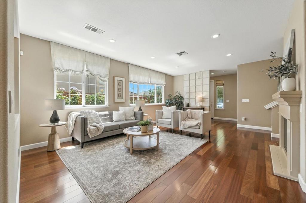 Welcome to your dream home in one of Morgan Hills most sought-after neighborhoods! This stunning residence blends comfort, elegance, and sustainability, featuring soaring 10-foot ceilings and rich engineered hardwood floors that create an airy and inviting ambiance throughout. The gourmet kitchen is a chef's dream, boasting a premium Thermador oven, under-cabinet lighting, a modern water filtration system, and a large granite kitchen island perfect for meal prep, casual dining, or entertaining. Owned solar panels provide energy efficiency, while a brand-new air conditioning/ heat pump unit ensures year-round comfort. Step into the expansive primary suite, your personal retreat, complete with a spa-like soaking tub, separate walk-in shower, and generous closet space. Outside, enjoy the peaceful serenity of your private backyard oasis. A charming pergola draped with mature olive trees and grapevines sets the scene for al fresco dining, surrounded by vibrant rose bushes. Tucked away on a quiet, tree-lined street, this home offers tranquility without sacrificing the 10-minute walk to downtown Morgan Hill restaurants and amenities.