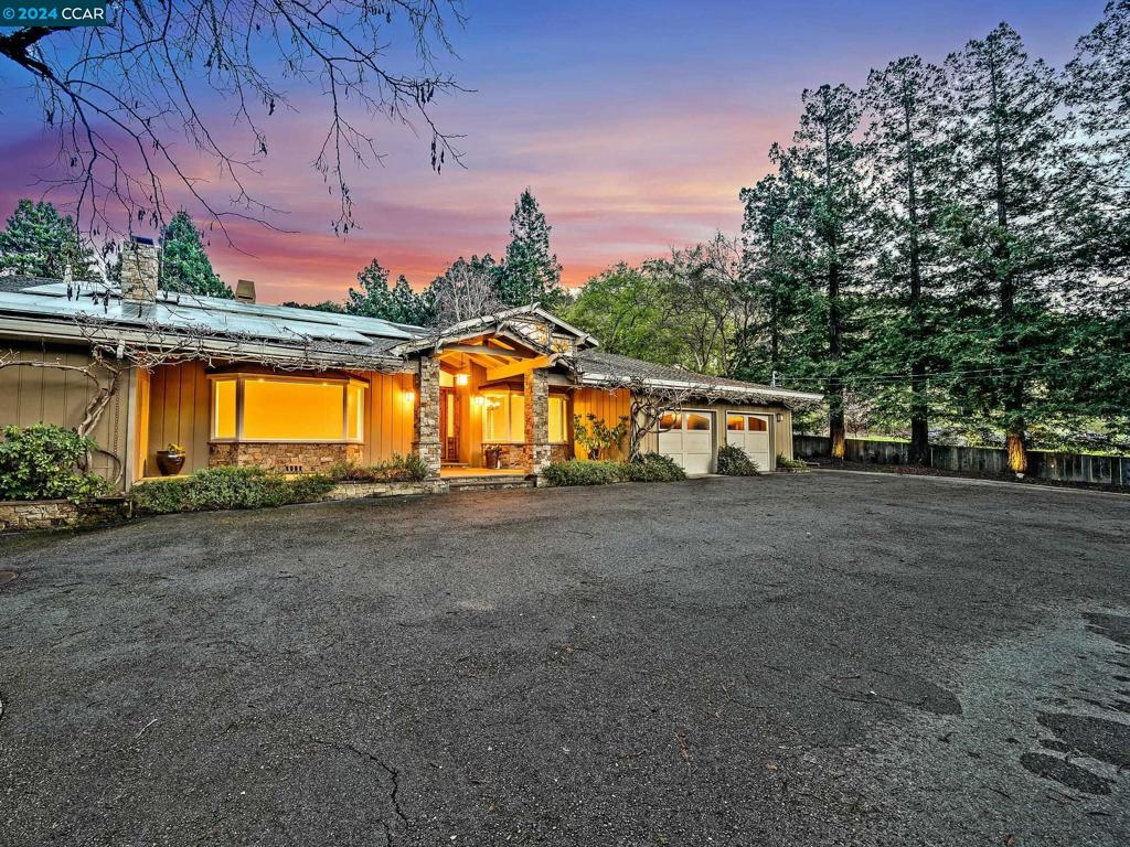 A breathtaking estate tucked away in prestigious Portola Valley situated on a private road off Arastradero in a serene and quaint neighborhood. This sprawling one-acre secluded lot is located in unincorporated Santa Clara County and connected to award winning Palo Alto schools. Main house features 6 bedrooms, 4.5 bathrooms and almost 4,500 square feet of expansive living space. An impressive grand foyer with vaulted ceilings leads to formal living and dining rooms. The expansive and inviting family room hosts wood beam ceilings, beautiful skylights enveloping the entire space with tons of natural light, built in shelving and a cozy fireplace. Perfectly appointed chef’s kitchen features stainless steel appliances, 6 burner gas stove, 2 pantries, oversized island with breakfast bar and an immense amount of cabinet space. Four generously sized bedrooms on the ground floor including 2 primary suites on opposite sides of the home. 2 more bedrooms upstairs with a loft. Unbelievable backyard with sparkling pool and separate pool house. Don’t miss the possible income producing ADU, offering potential for rental income or guest accommodations. Conveniently located near the iconic Alpine Inn, where you can enjoy casual dining and a relaxed atmosphere.